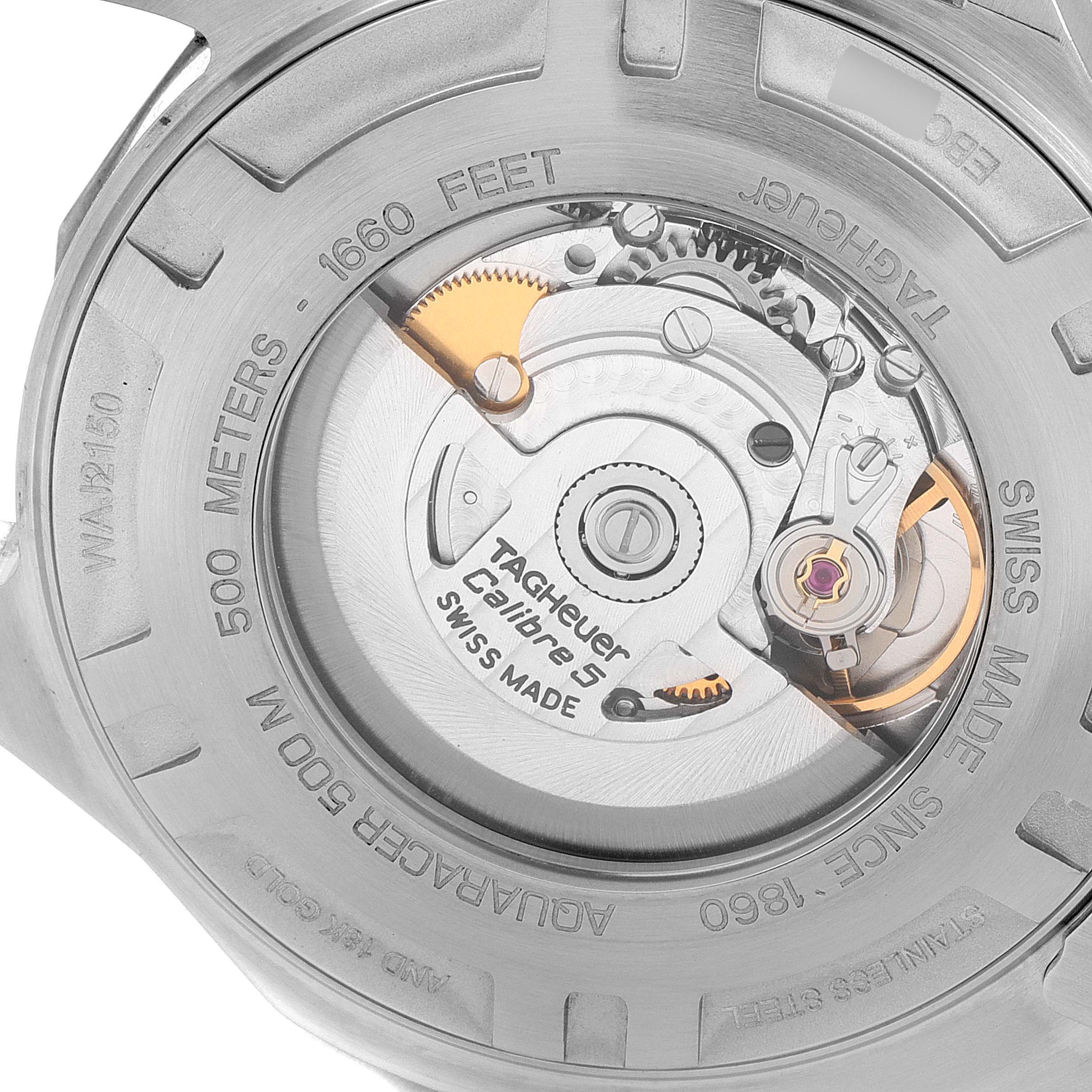 The image shows the back side of the Tag Heuer Aquaracer WAJ2150.BA0870 Men's Steel and Gold (two tone) Black Dial WAJ2150.BA0870 Men's Steel and Gold (two tone) Black Dial watch, highlighting the internal mechanics and movement.
