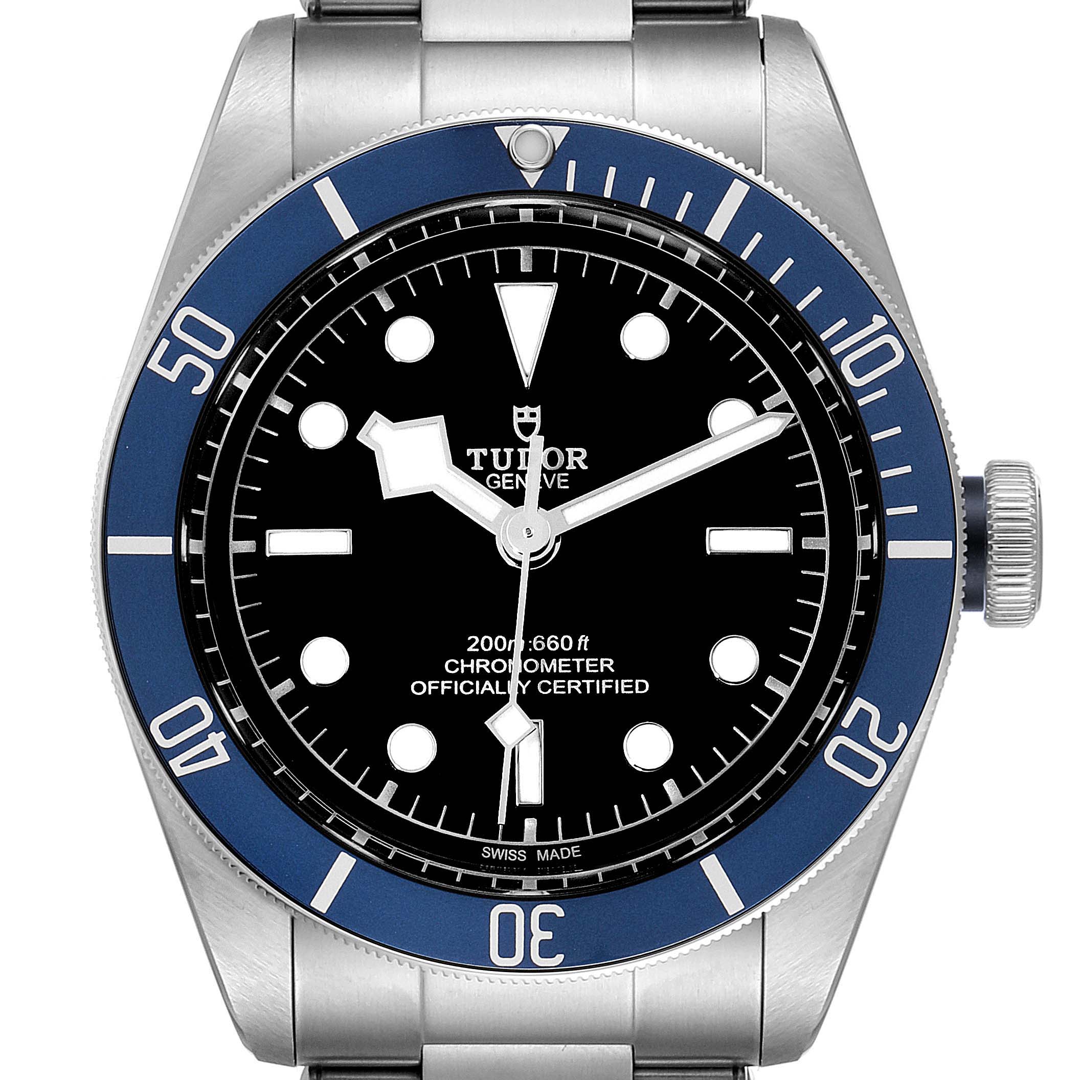 The watch is shown from a top-down angle displaying the face, bezel, and part of the strap of the Tudor Heritage Black Bay 79230B Men's Stainless Steel Black Dial 79230B Men's Stainless Steel Black Dial model.
