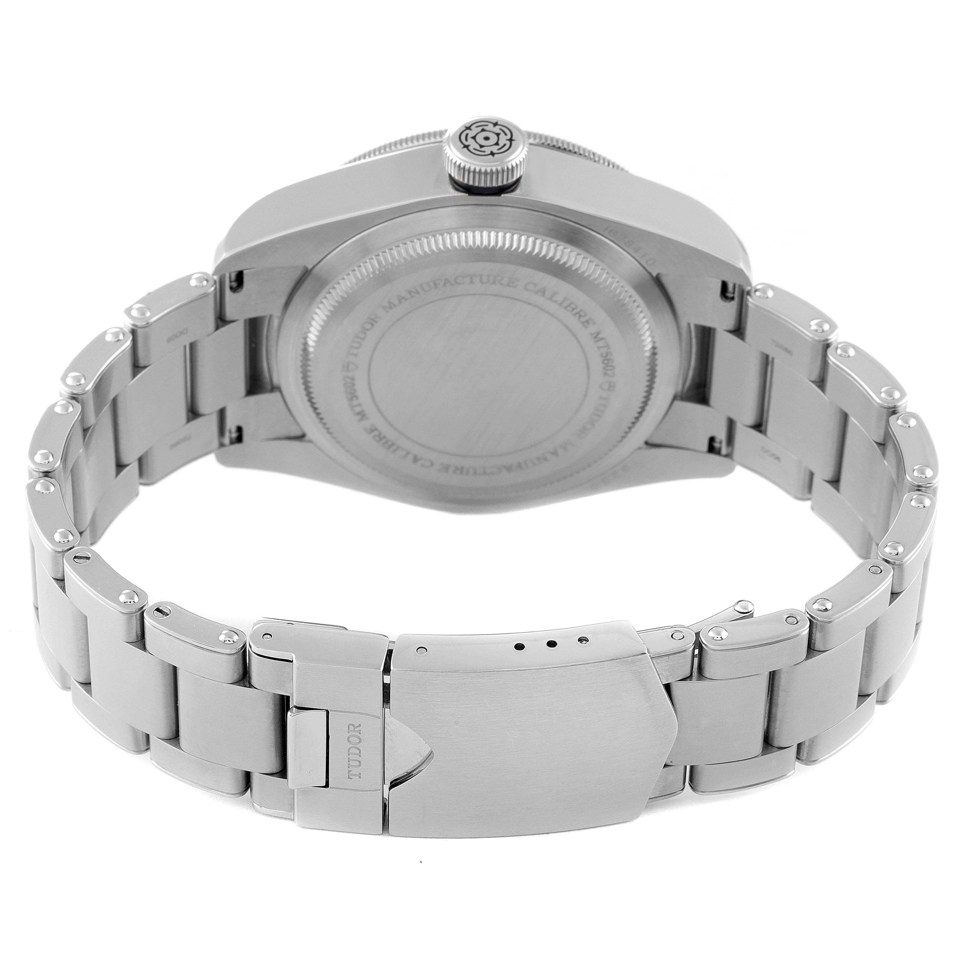 The image shows the backside view of the Tudor Heritage Black Bay 79230B Men's Stainless Steel Black Dial 79230B Men's Stainless Steel Black Dial watch, focusing on the case back and metal bracelet with clasp.