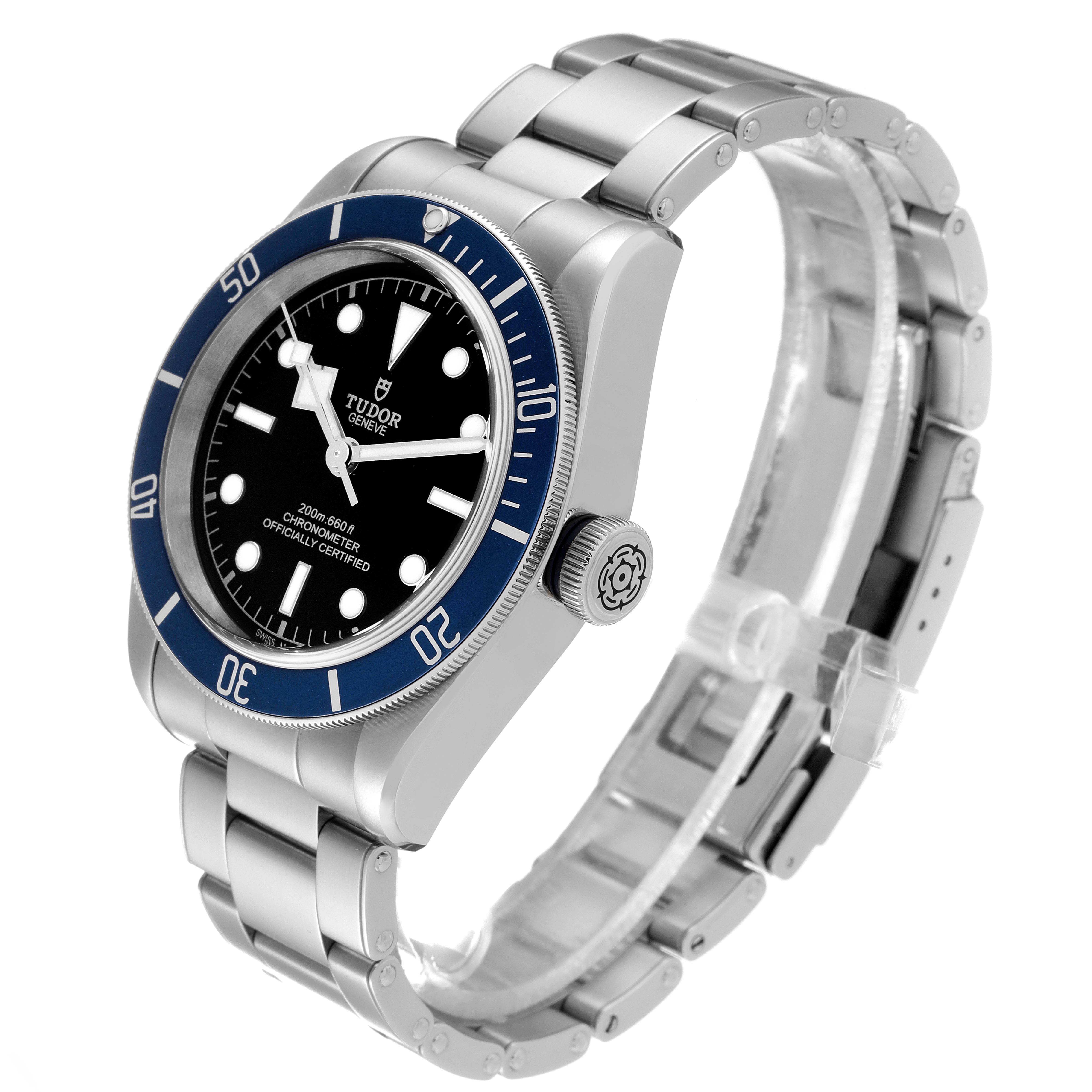 The Tudor Heritage Black Bay 79230B Men's Stainless Steel Black Dial 79230B Men's Stainless Steel Black Dial watch is shown at a 3/4 angle, highlighting the face, bezel, crown, and bracelet.