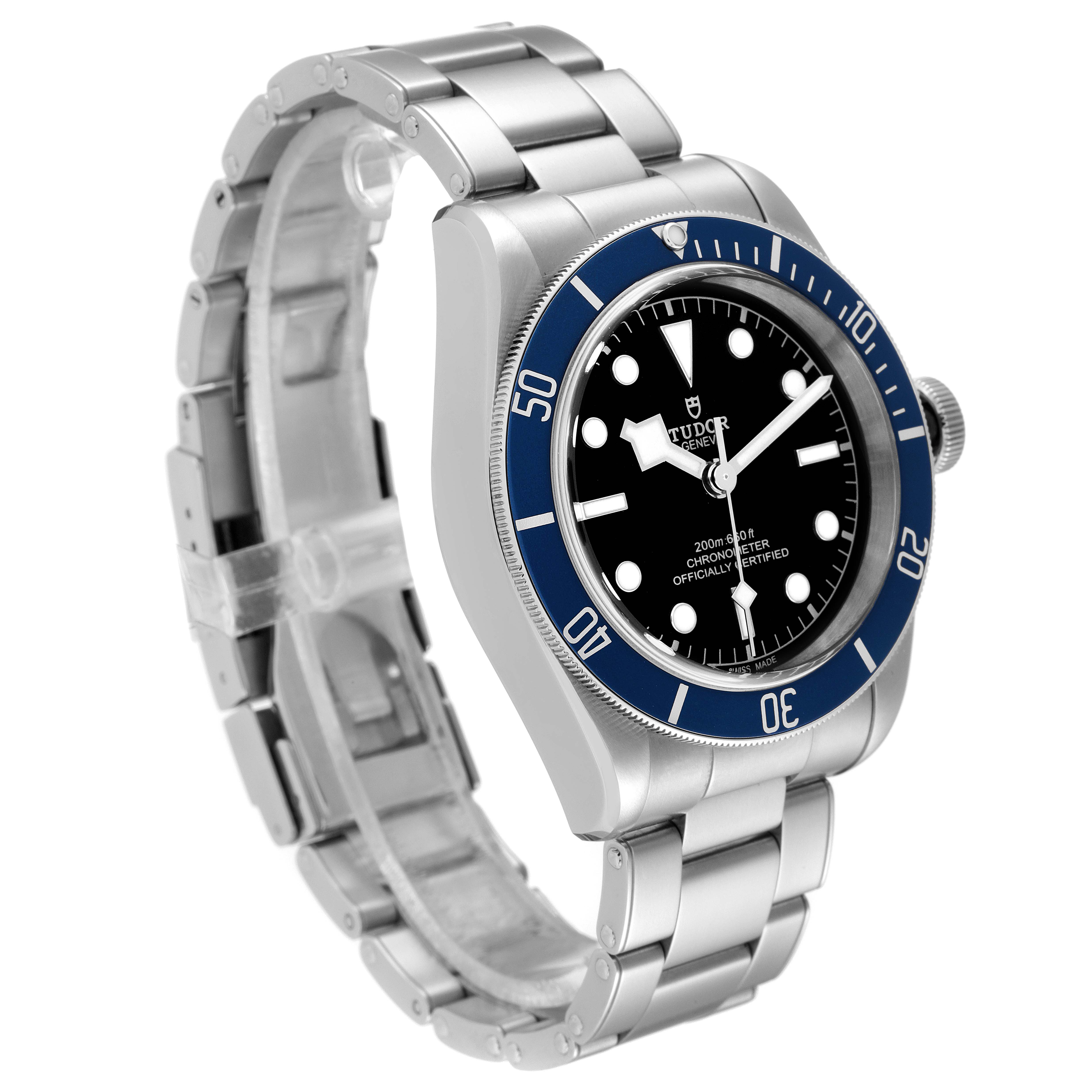 The Tudor Heritage Black Bay 79230B Men's Stainless Steel Black Dial 79230B Men's Stainless Steel Black Dial watch is shown at a three-quarter angle with its face, bezel, bracelet, and crown visible.