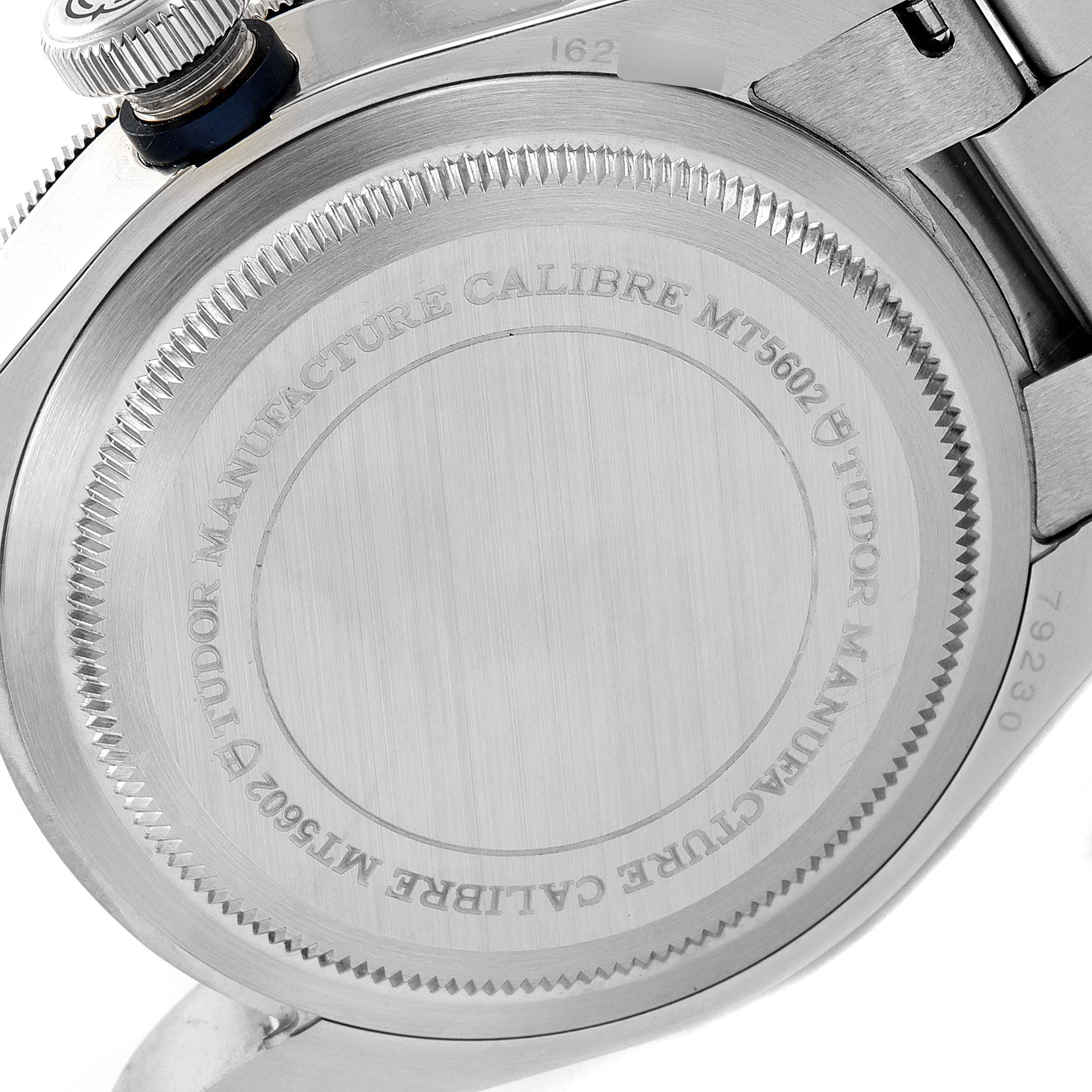 This image shows the back casing and crown of the Tudor Heritage Black Bay 79230B Men's Stainless Steel Black Dial 79230B Men's Stainless Steel Black Dial watch, highlighting its "Tudor Manufacture Calibre MT5602" inscription.