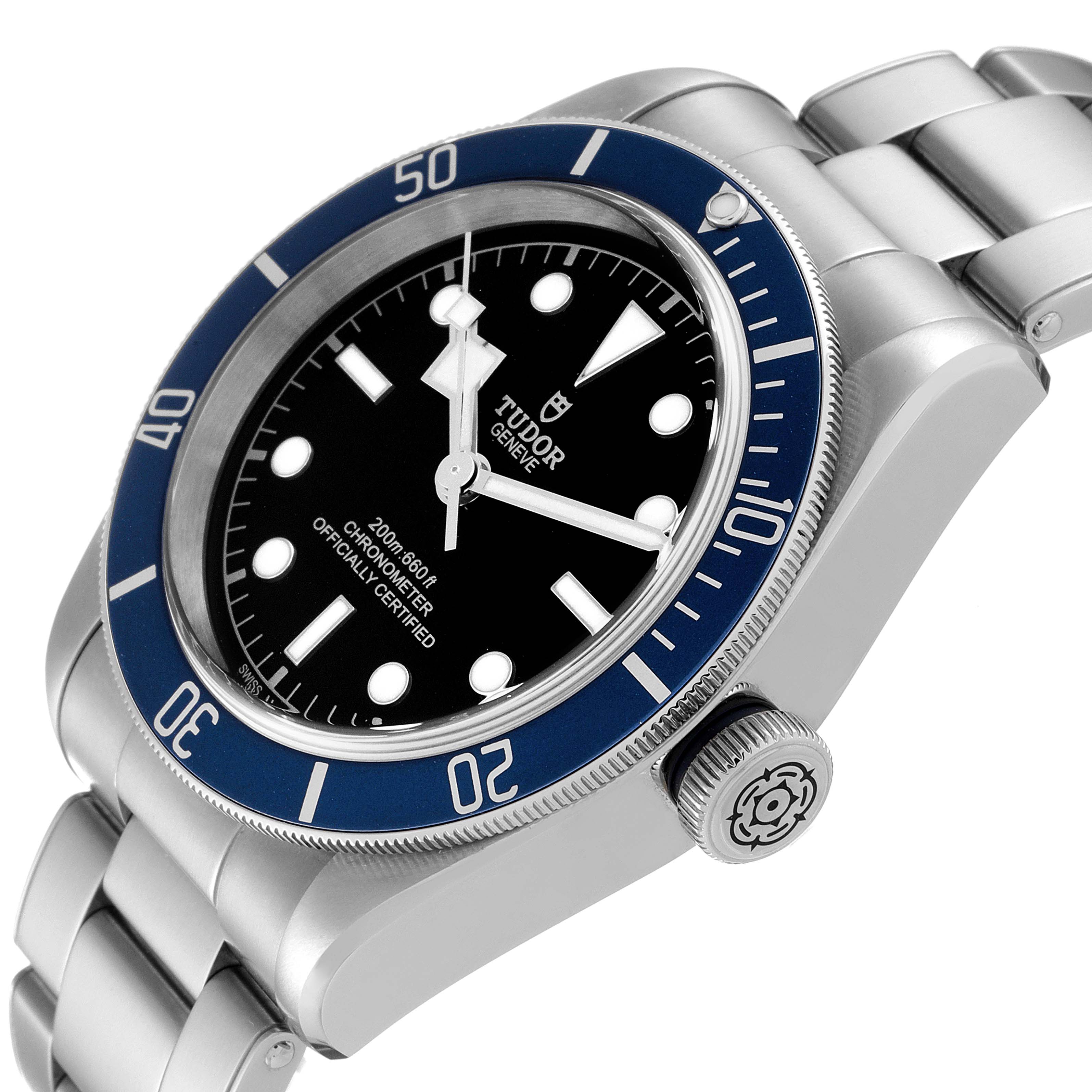 The Tudor Heritage Black Bay 79230B Men's Stainless Steel Black Dial 79230B Men's Stainless Steel Black Dial watch is shown at a slight angle, displaying the face, bezel, crown, and bracelet.