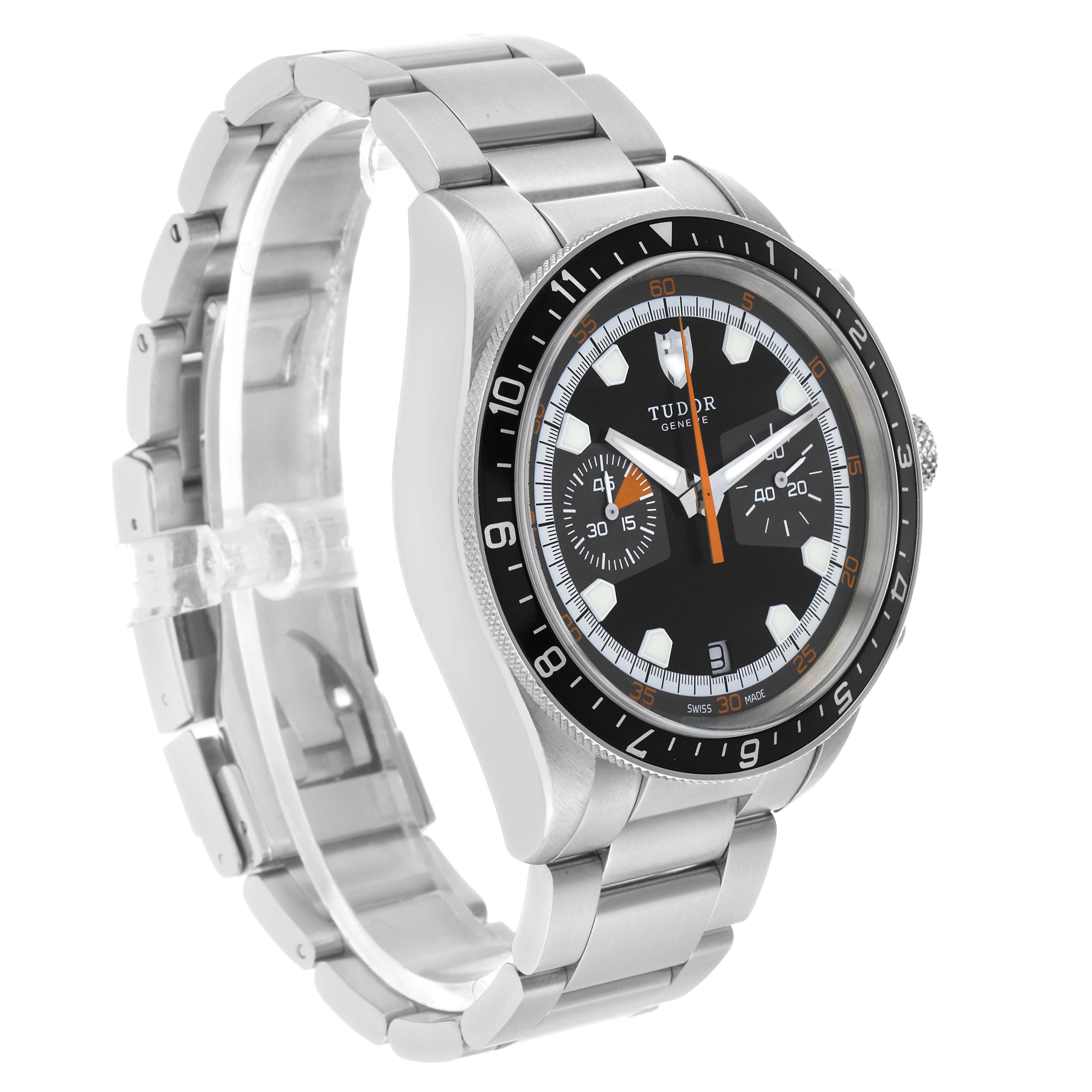 The Tudor Heritage Chrono 70330N Men's Stainless Steel Black Dial watch is shown at a three-quarter angle, displaying its face, bezel, and metal bracelet.