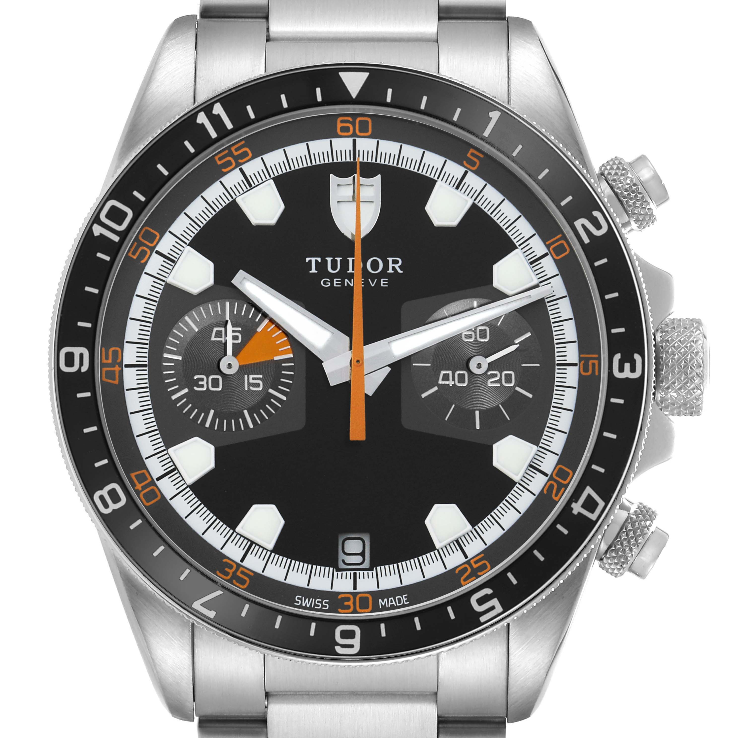 The Tudor Heritage Chrono 70330N Men's Stainless Steel Black Dial watch is shown from a front angle, highlighting the dial, bezel, and crown.
