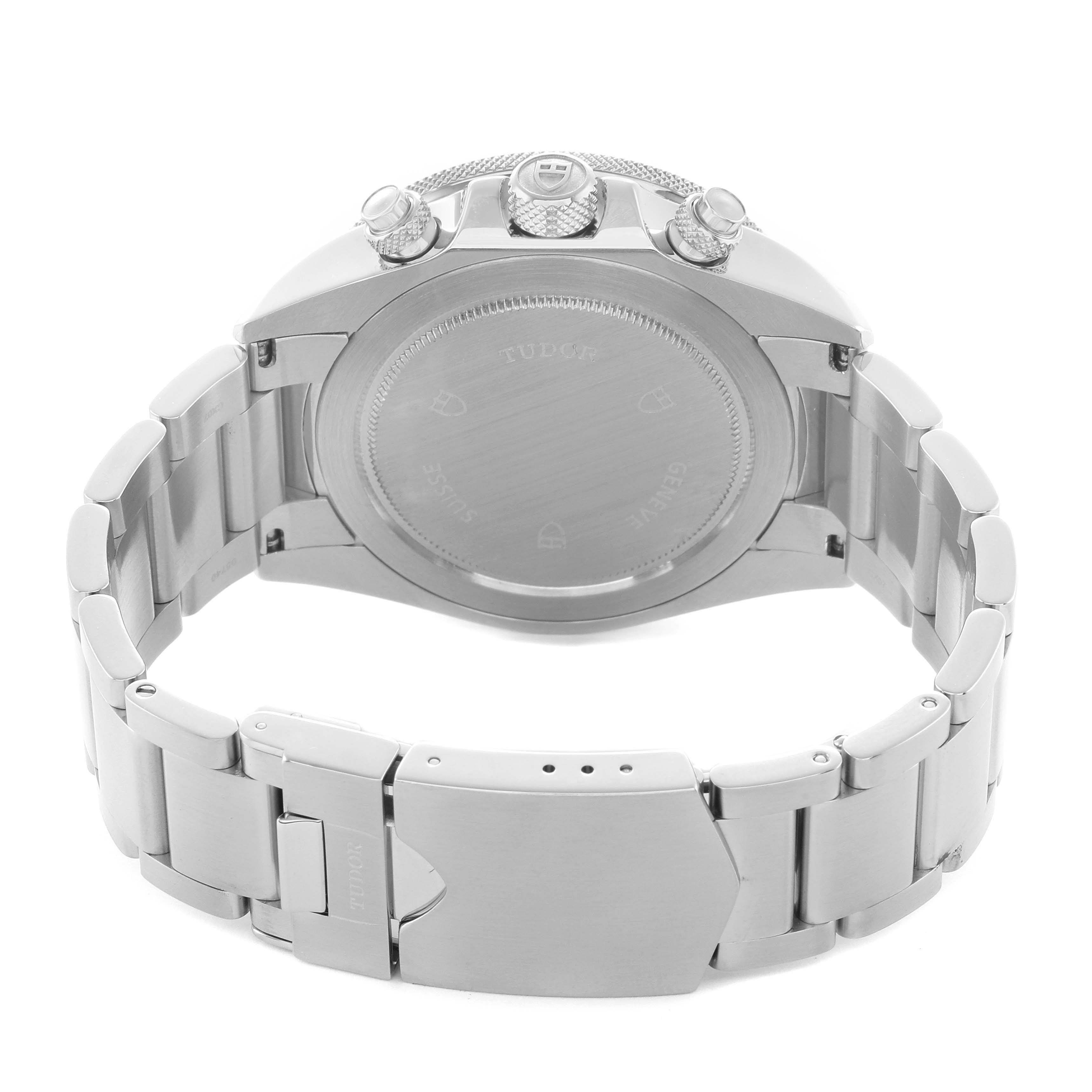 The Tudor Heritage Chrono 70330N Men's Stainless Steel Black Dial is shown from the back, highlighting the case back, bracelet, clasp, and side pushers.