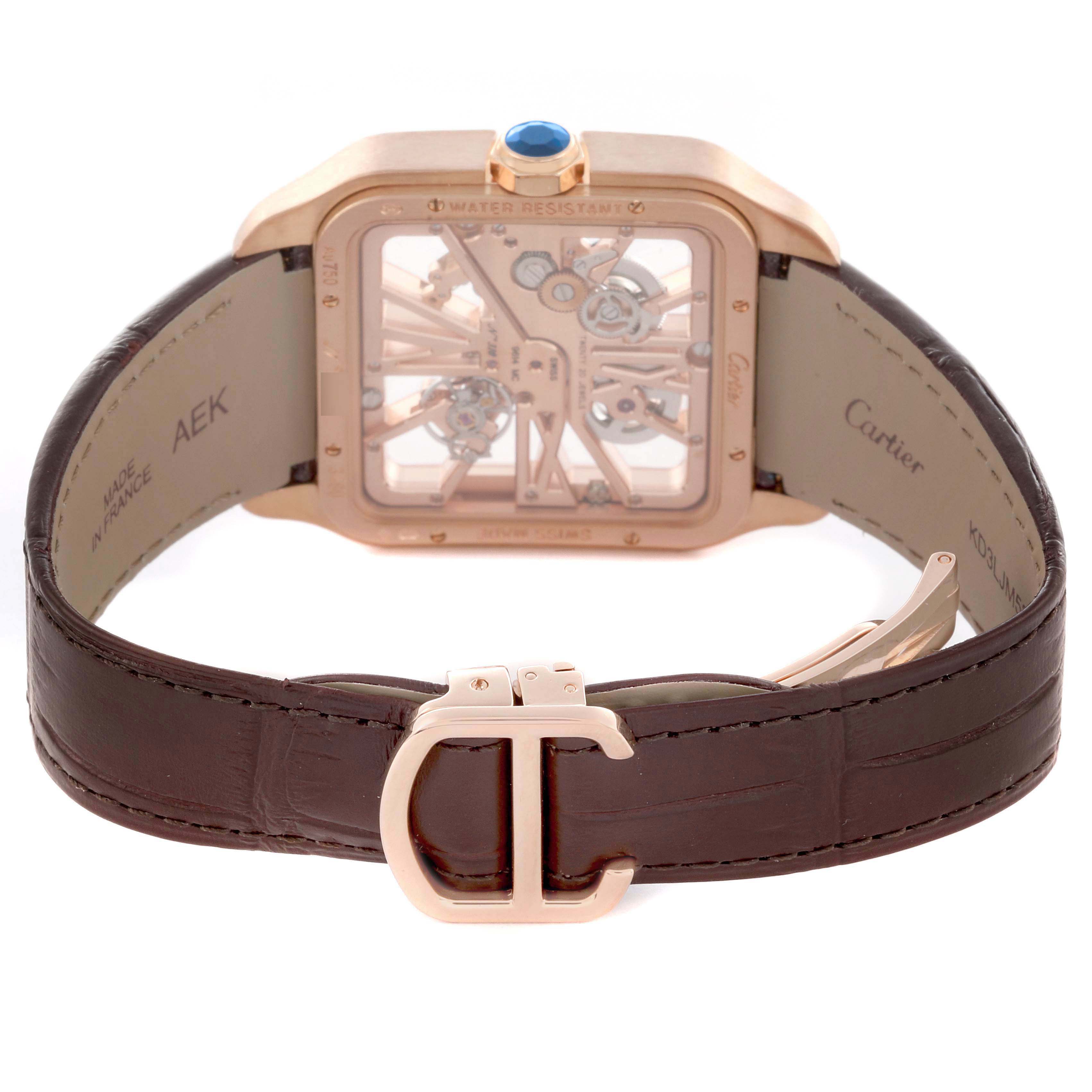 The image shows a rear view of the Cartier Santos W2020057 Men's Rose Gold Transparent Dial watch, highlighting the strap and clasp.