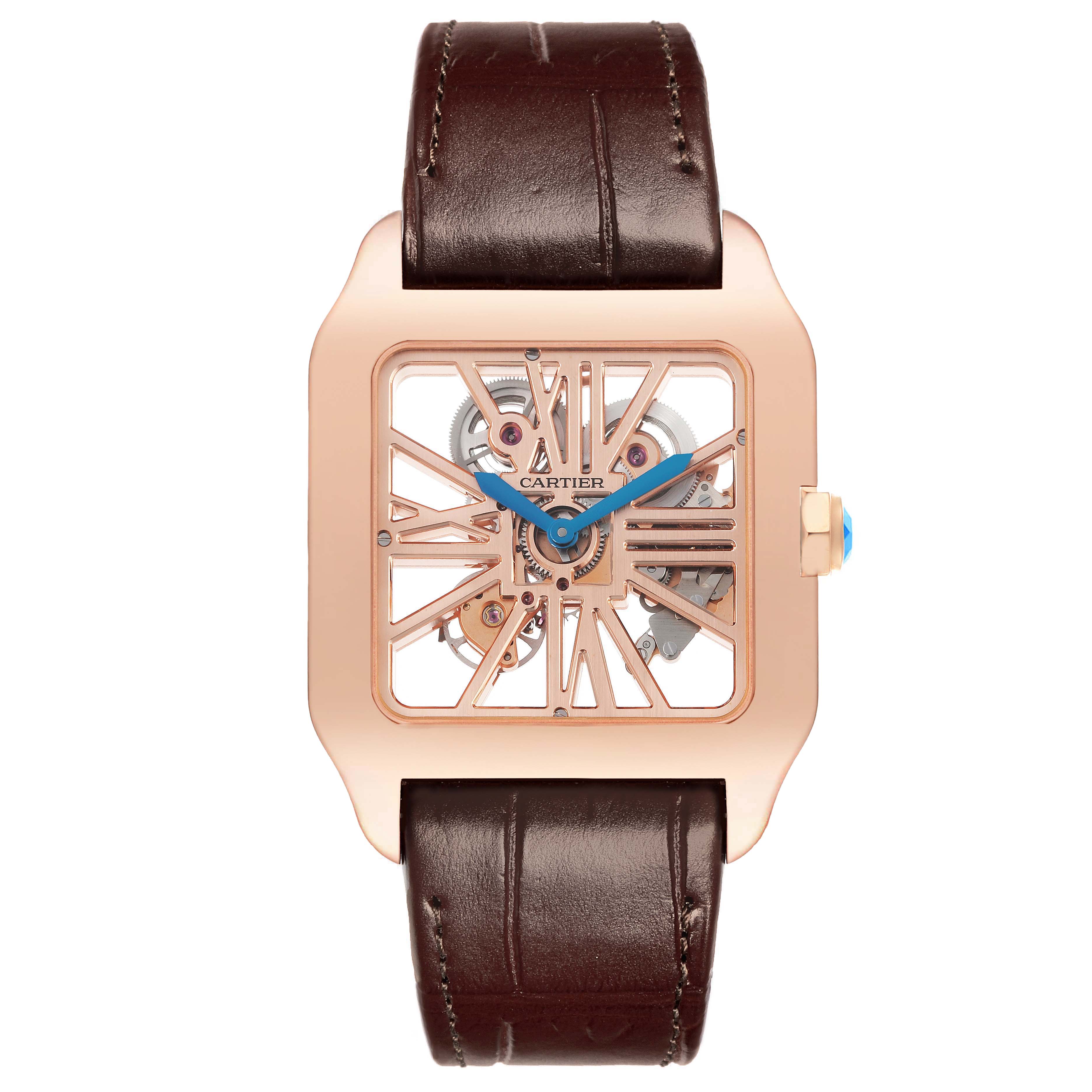 The Cartier Santos W2020057 Men's Rose Gold Transparent Dial watch is shown from the front, highlighting its skeleton dial and brown leather strap.