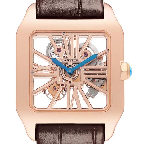 The image shows a front view of a Santos de Cartier watch, featuring an open skeleton dial and blue hands.