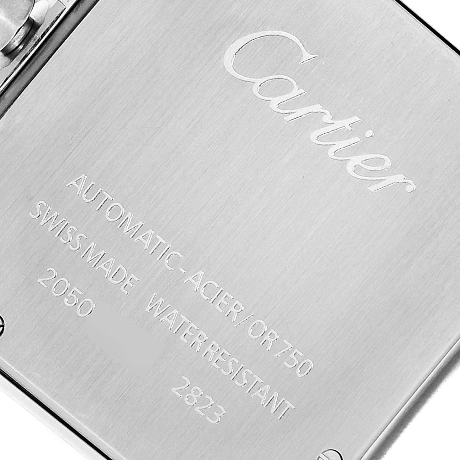 The image shows a close-up of the back case of a Cartier Santos W20099C4 Men's Steel and Gold (two tone) Silver Dial W20099C4 Men's Steel and Gold (two tone) Silver Dial watch, highlighting the engraving details.