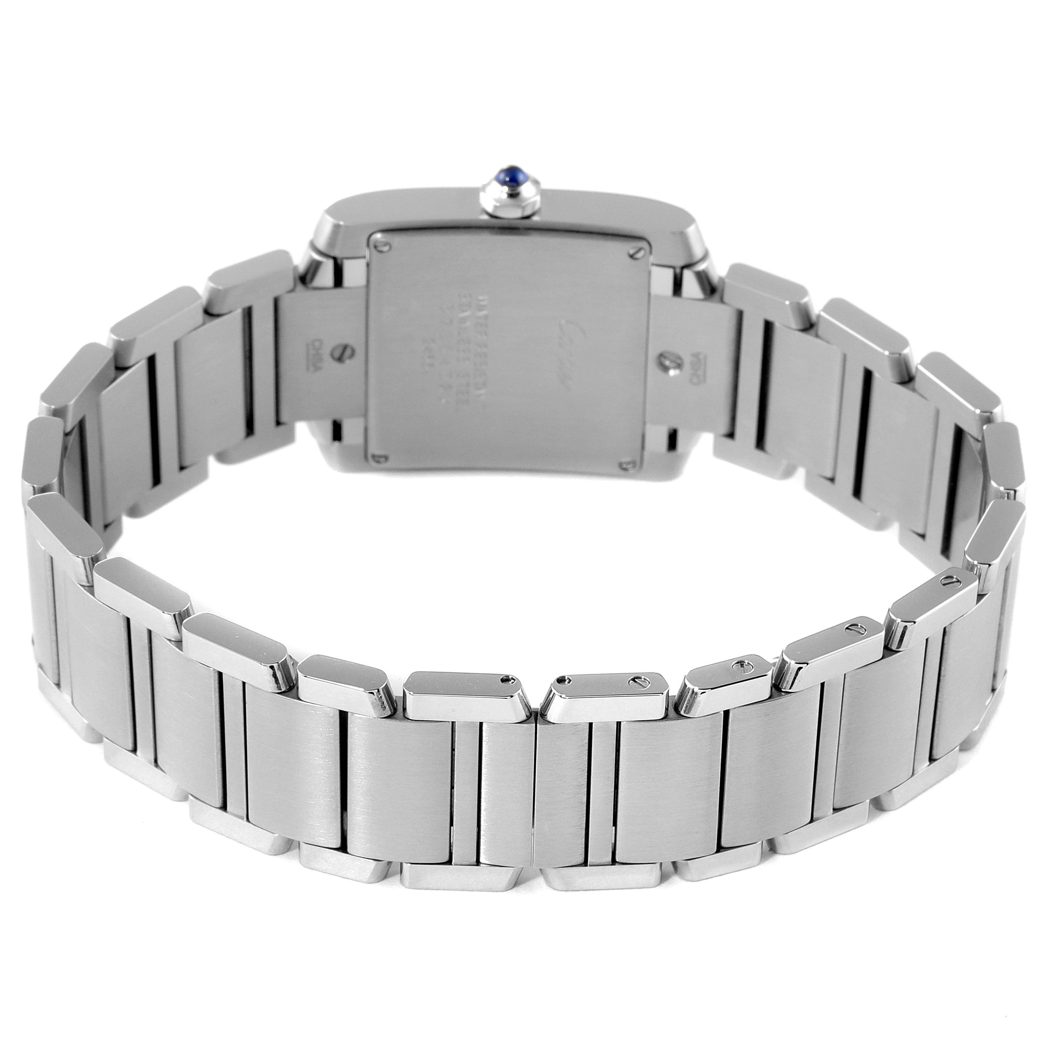 The image shows the back view of a Tank Francaise model by Cartier, featuring the case back and metal bracelet.