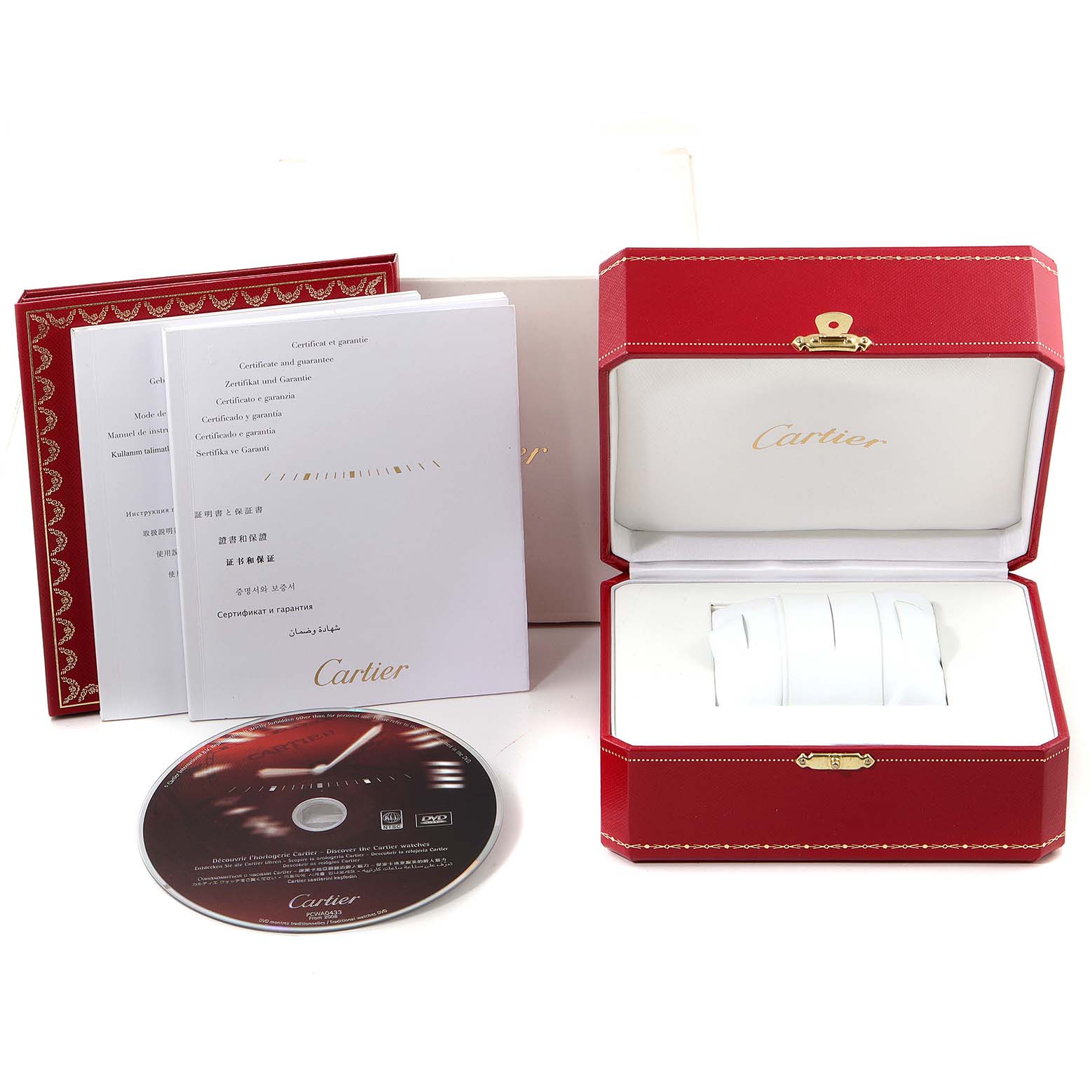 The image shows a Tank Francaise model by Cartier with its open red box, certificate booklets, and a CD/DVD accessory, from an overhead angle.