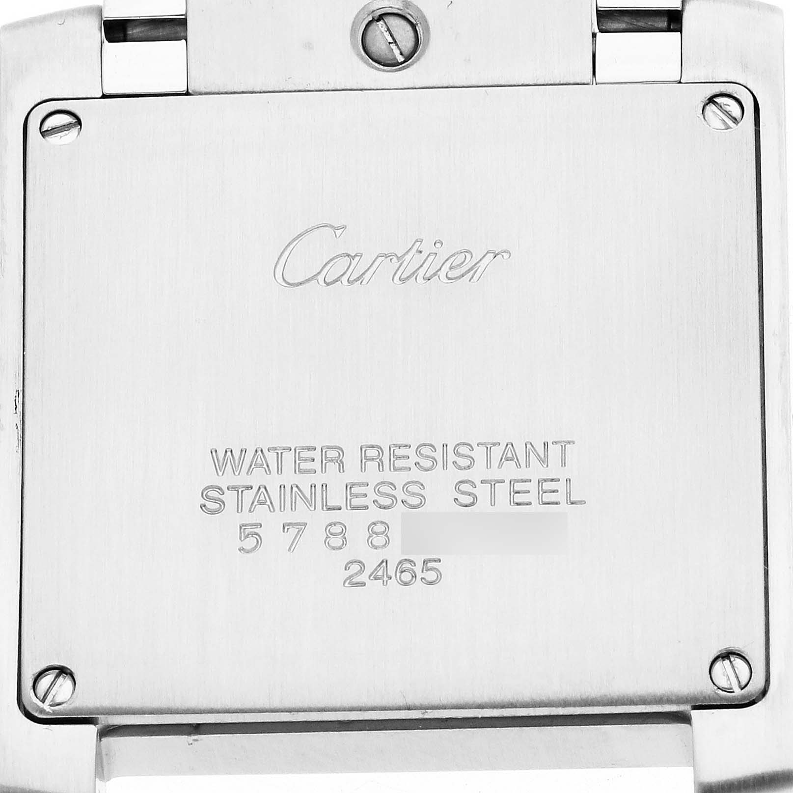 The image shows the back plate of a Cartier Tank Française watch, displaying the brand name and specifications.