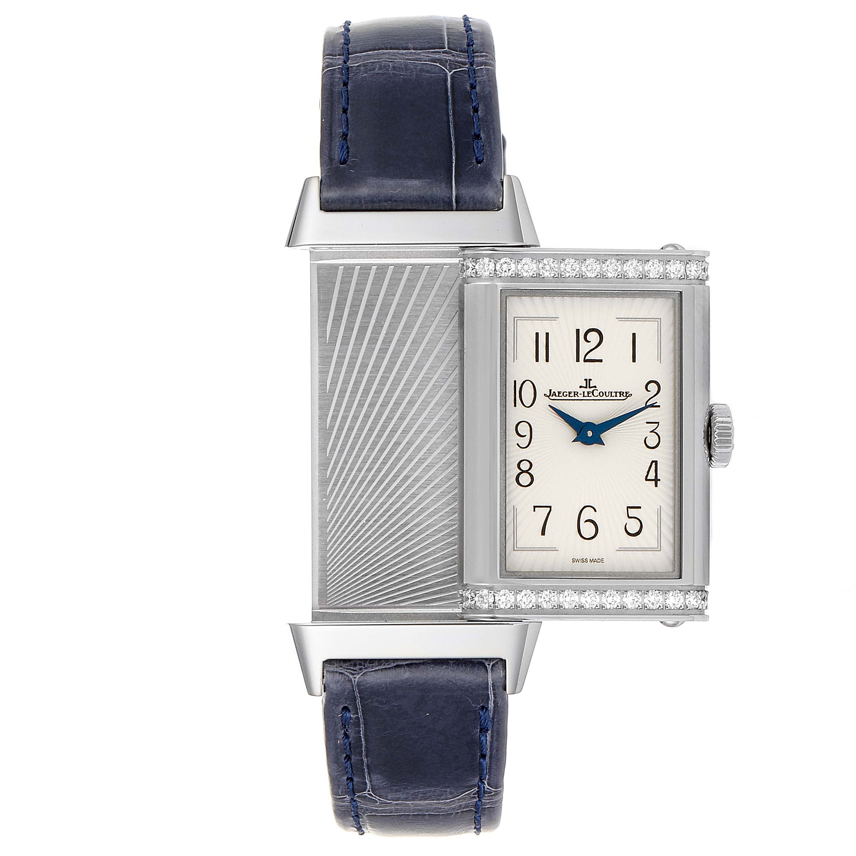 The image shows a Jaeger-LeCoultre Reverso watch with its case partially swiveled to reveal the backside engraving.