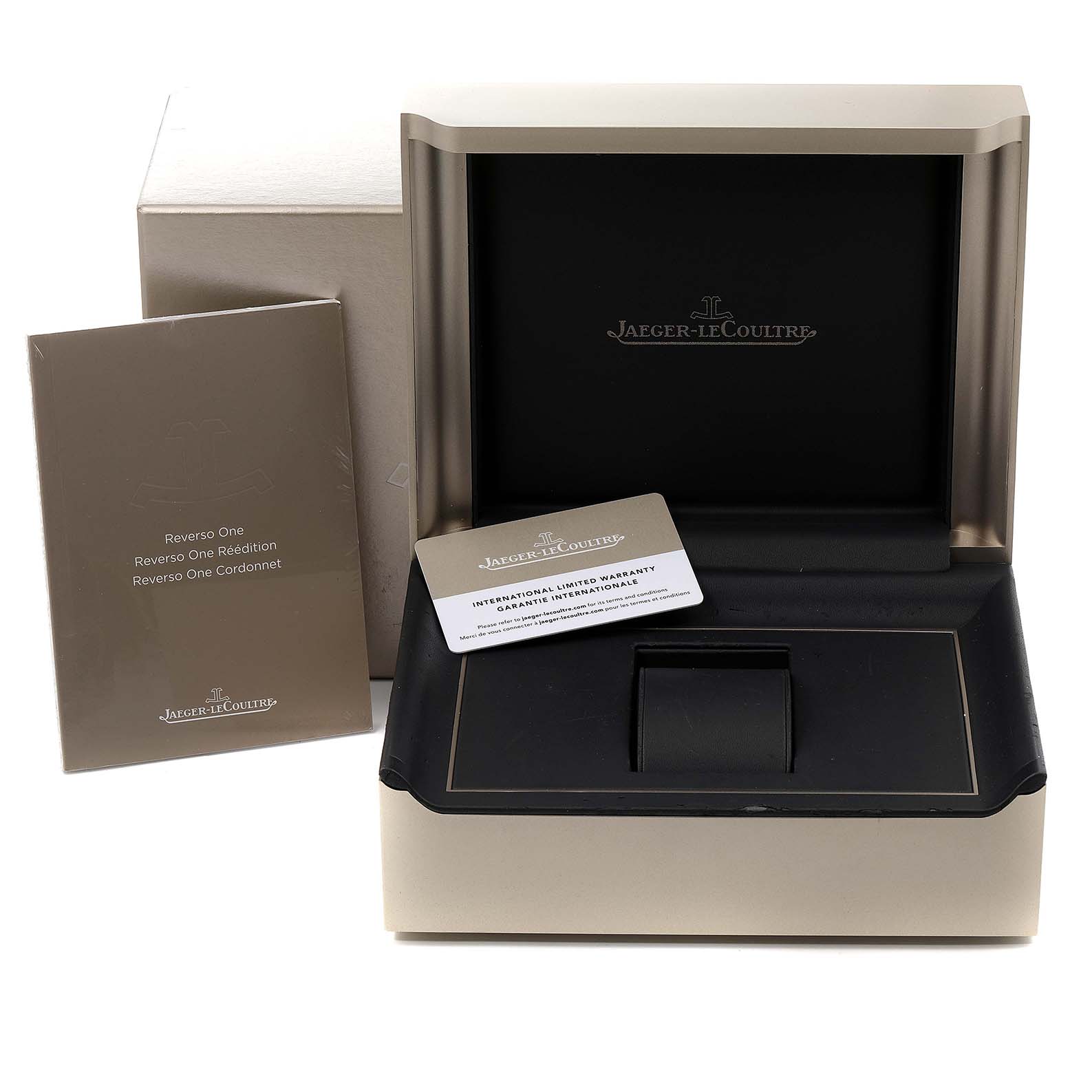 The image shows the packaging, manuals, and warranty card of a Jaeger LeCoultre Reverso Q3288420 Women's Stainless Steel Silver Dial Q3288420 Women's Stainless Steel Silver Dial model watch.
