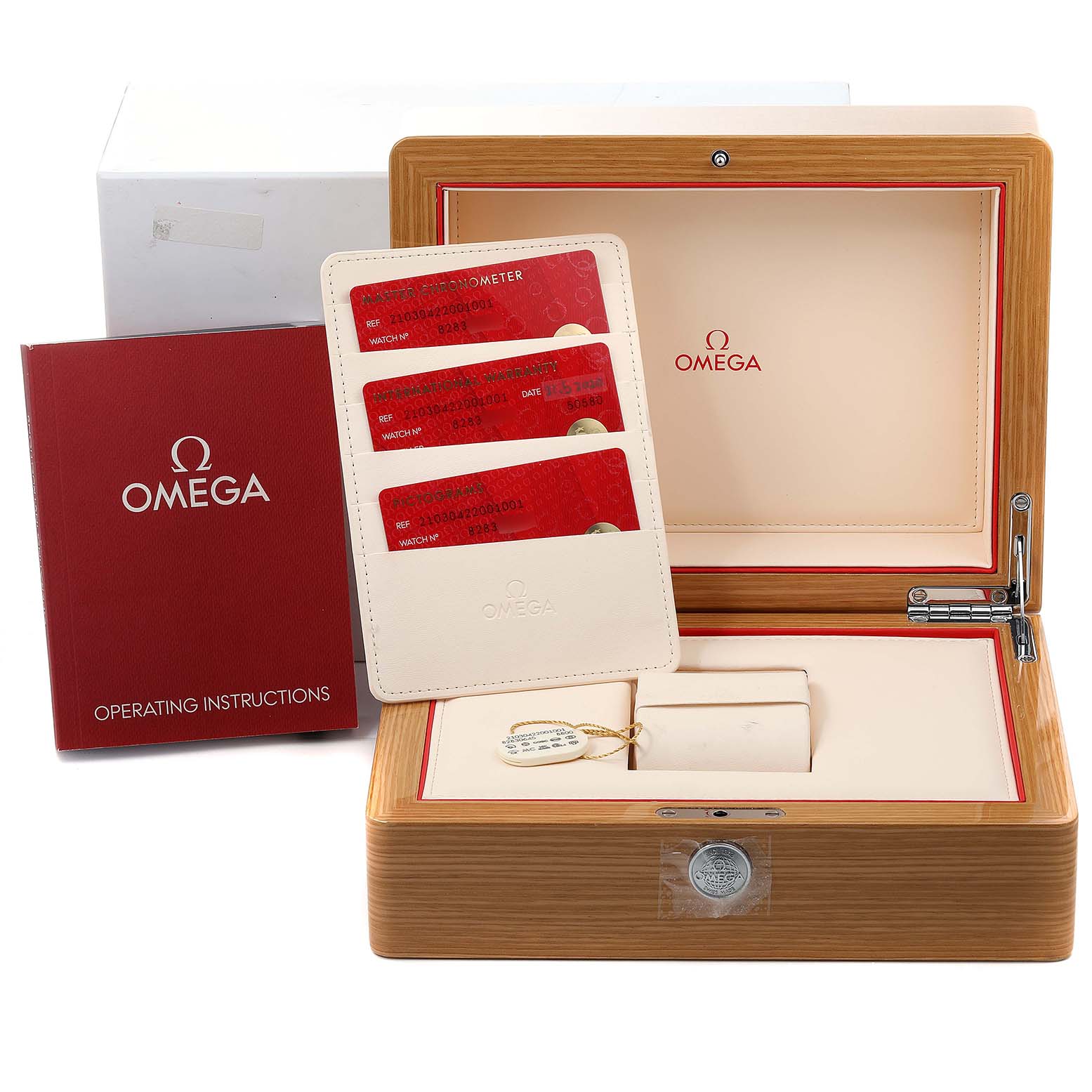 This image shows the accessories for the Omega Seamaster 210.30.42.20.01.001 Men's Stainless Steel Black Dial 210.30.42.20.01.001 Men's Stainless Steel Black Dial, including a wooden box, instruction manual, warranty cards, and a tag.