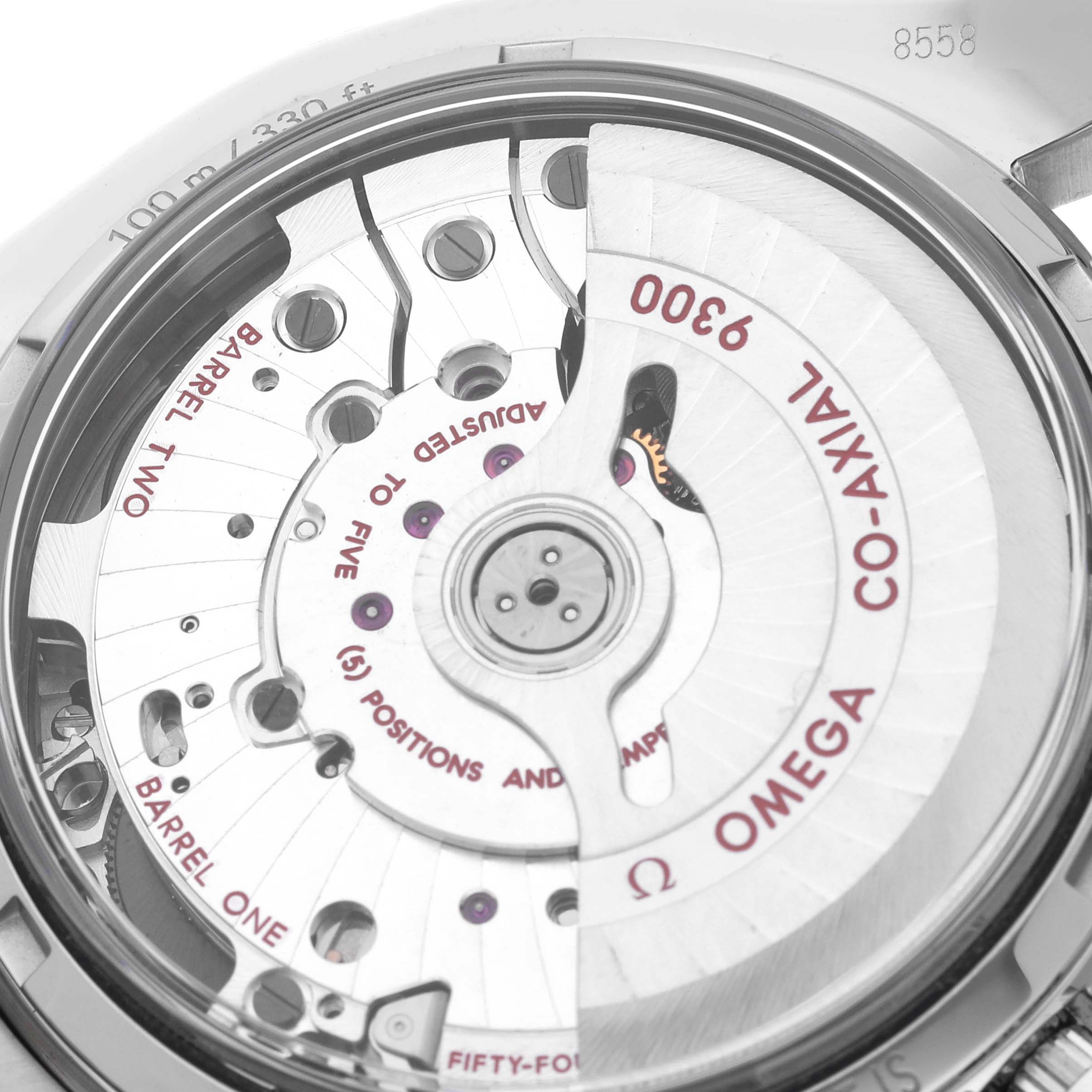 The image shows the movement of an Omega Seamaster 311.30.44.51.01.002 Men
s Stainless Steel Black Dial 311.30.44.51.01.002 Men
s Stainless Steel Black Dial, highlighting the co-axial mechanism and detailed engravings.