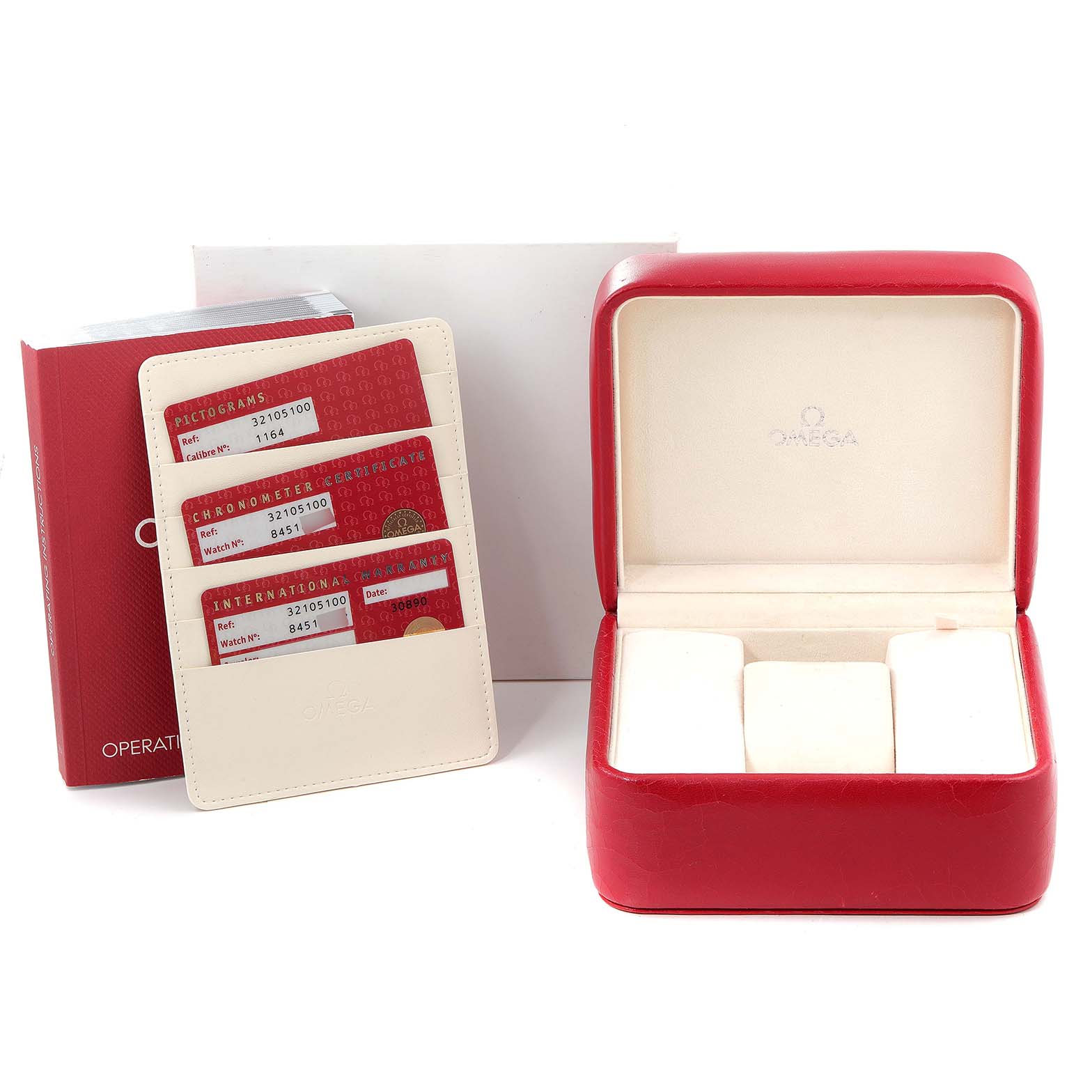 The image shows the packaging and accessories of an Omega Speedmaster 3210.51.00 Men
s Stainless Steel Black Dial 3210.51.00 Men
s Stainless Steel Black Dial, including a red watch box, user manuals, and warranty cards.