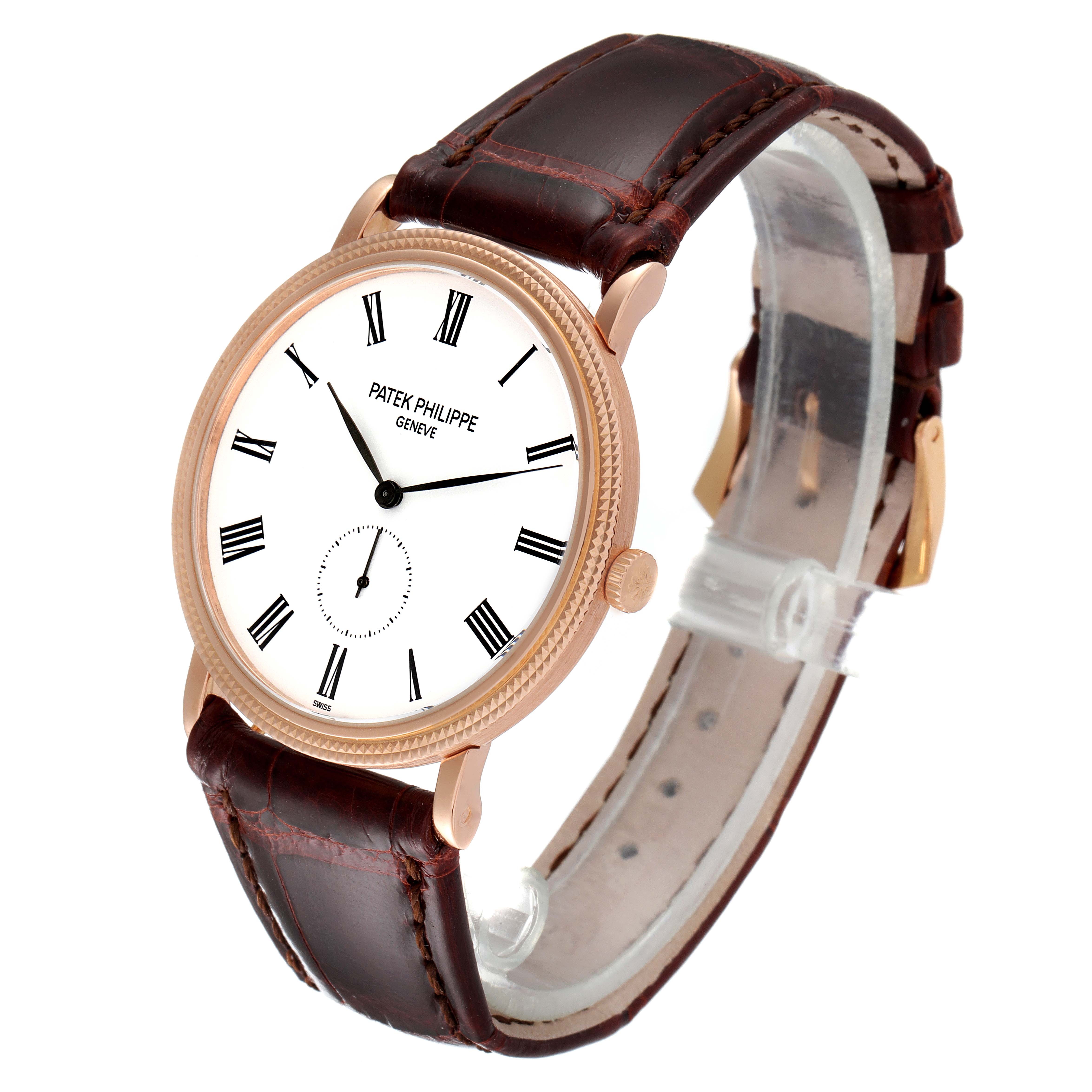 The Patek Philippe Calatrava 5119R Men's Rose Gold White Dial 5119R Men's Rose Gold White Dial watch is shown at a three-quarter angle, highlighting its face, bezel, crown, and leather strap.