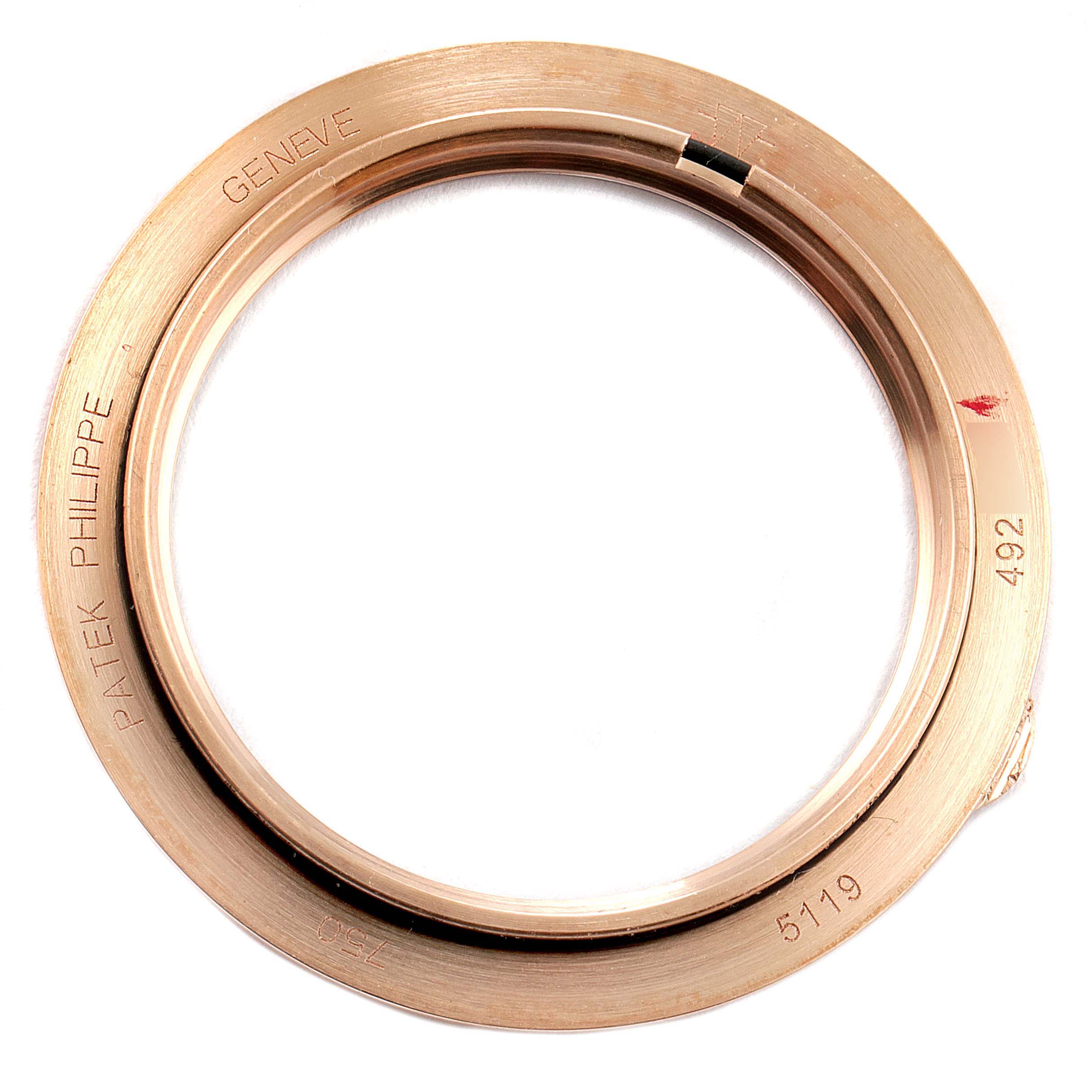 The image shows a bezel for a Patek Philippe Calatrava 5119R Men's Rose Gold White Dial 5119R Men's Rose Gold White Dial model 5119 watch from a top-down angle.
