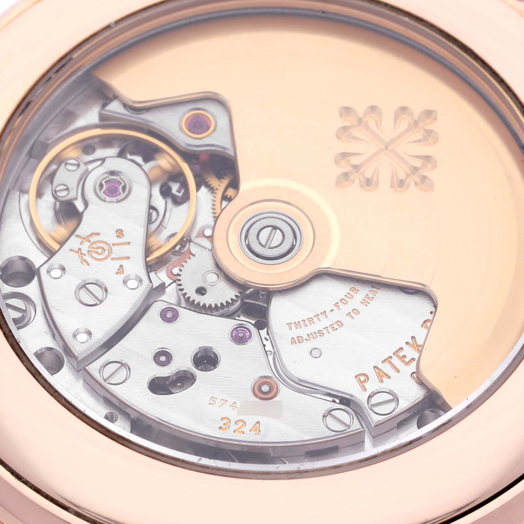 The image shows the intricate movement and mechanism of the Patek Philippe Complications 5396R-011 Men
s Rose Gold Silver Dial 5396R-011 Men
s Rose Gold Silver Dial model from the back.