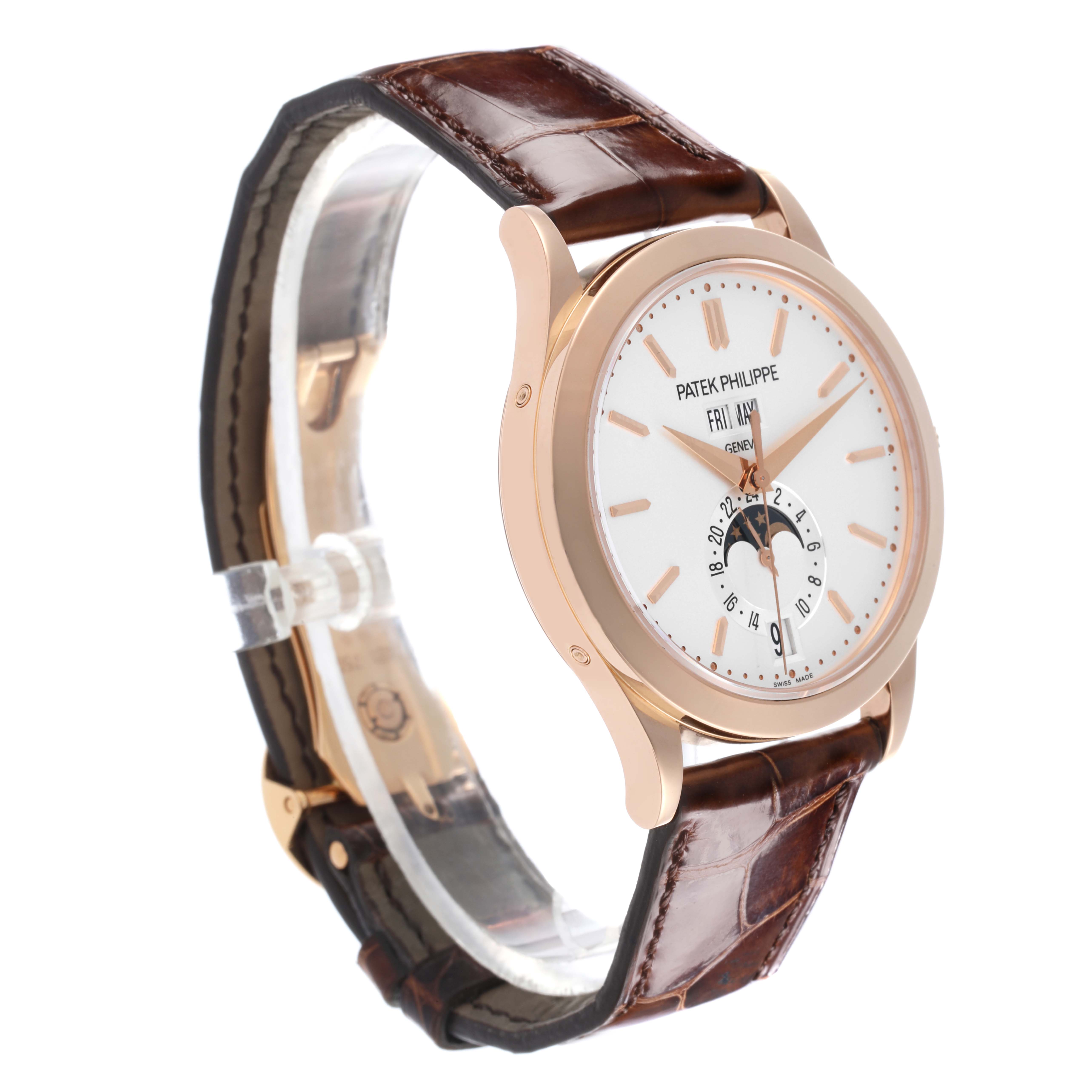 The Patek Philippe Complications 5396R-011 Men
s Rose Gold Silver Dial 5396R-011 Men
s Rose Gold Silver Dial watch is shown from a side angle, highlighting its dial, case, and brown leather strap.