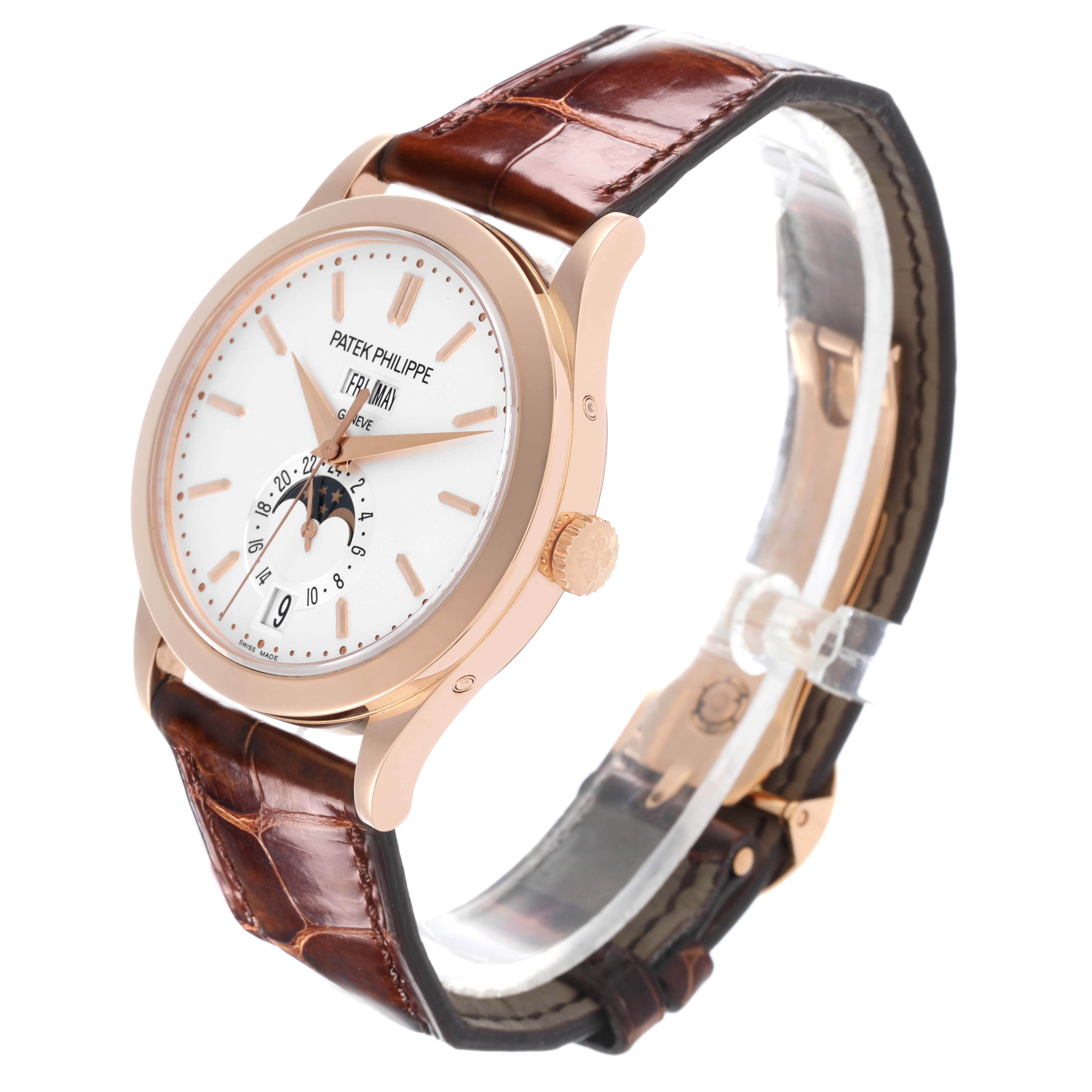 The Patek Philippe Complications 5396R-011 Men
s Rose Gold Silver Dial 5396R-011 Men
s Rose Gold Silver Dial watch is shown at an angled side view, displaying the dial, case, crown, and brown strap.