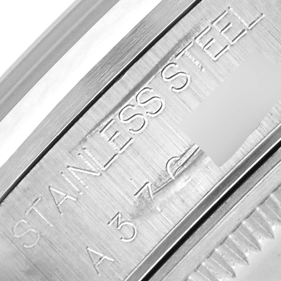 This image shows a close-up of the stainless steel casing with engravings on the Rolex Air-King 14000 Men's Stainless Steel Blue Dial 14000 Men's Stainless Steel Blue Dial watch.