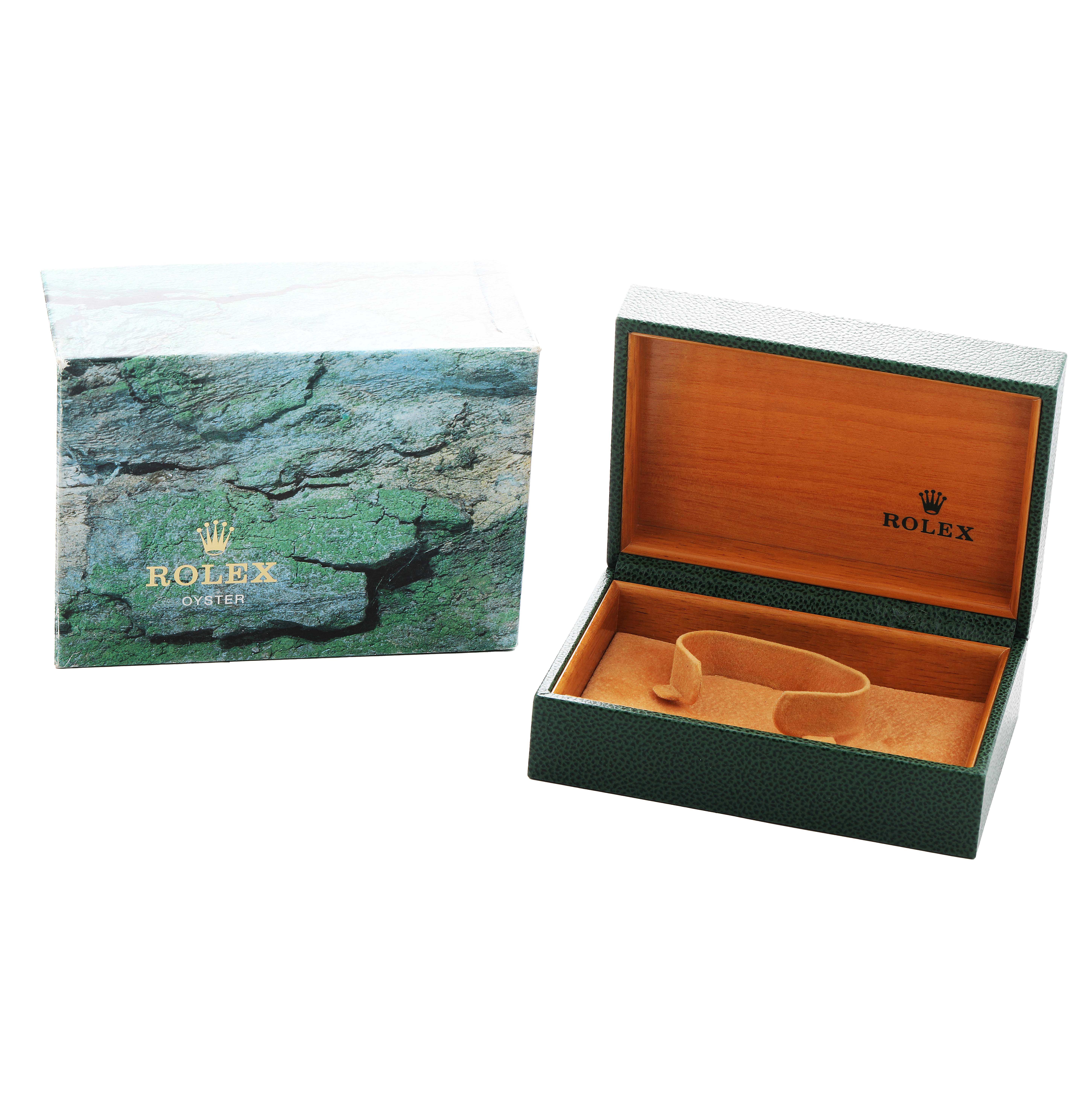 The image shows the open box and outer box for a Rolex Air-King 14010 Men's Stainless Steel Silver Dial watch, featuring the brand's logo and green textured design.