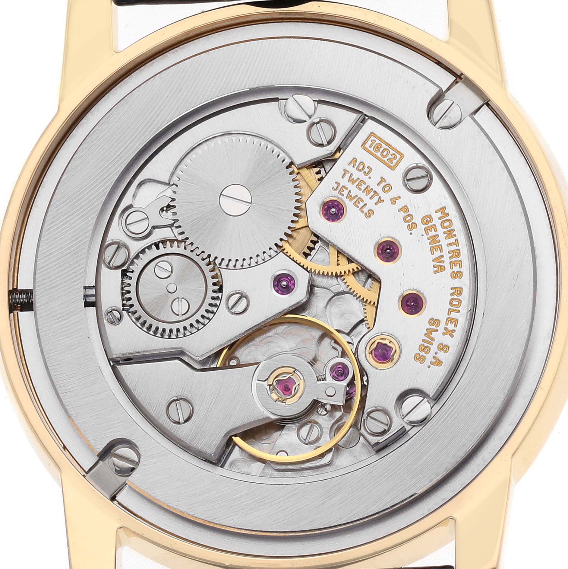 The image shows the back view of a Rolex Cellini 5116/8 Men's Yellow Gold White Dial watch, highlighting its intricate mechanical movement.