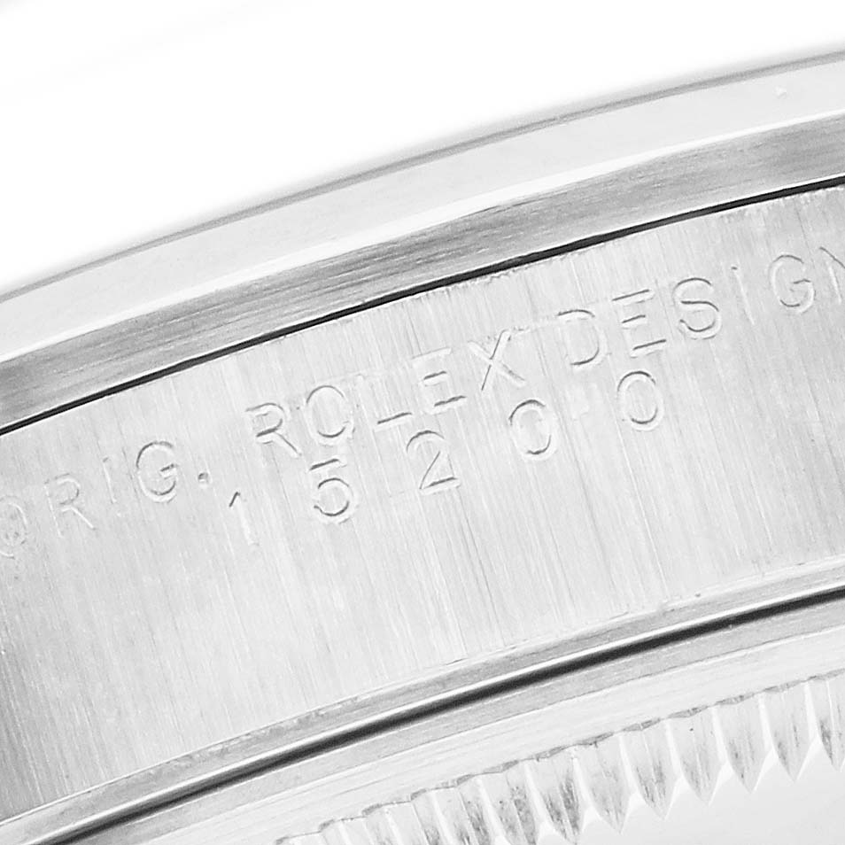 The image shows a close-up of the Rolex Date 15200 Men's Stainless Steel Black Dial model's side, focusing on engraved text and part of the bezel.
