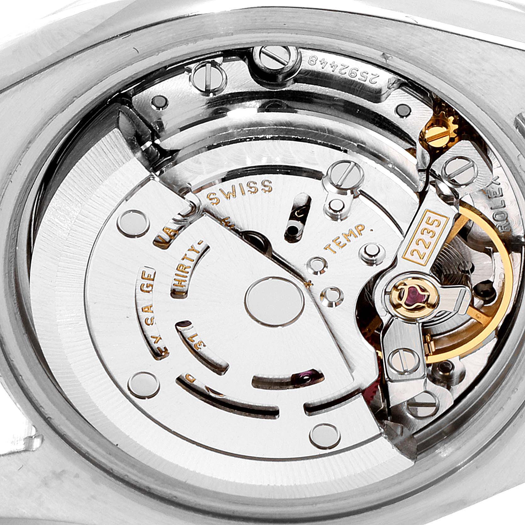 The image shows a close-up of the movement mechanism inside a Rolex Datejust 179173 Women
s Steel and Gold (two tone) Champagne Dial 179173 Women
s Steel and Gold (two tone) Champagne Dial watch.