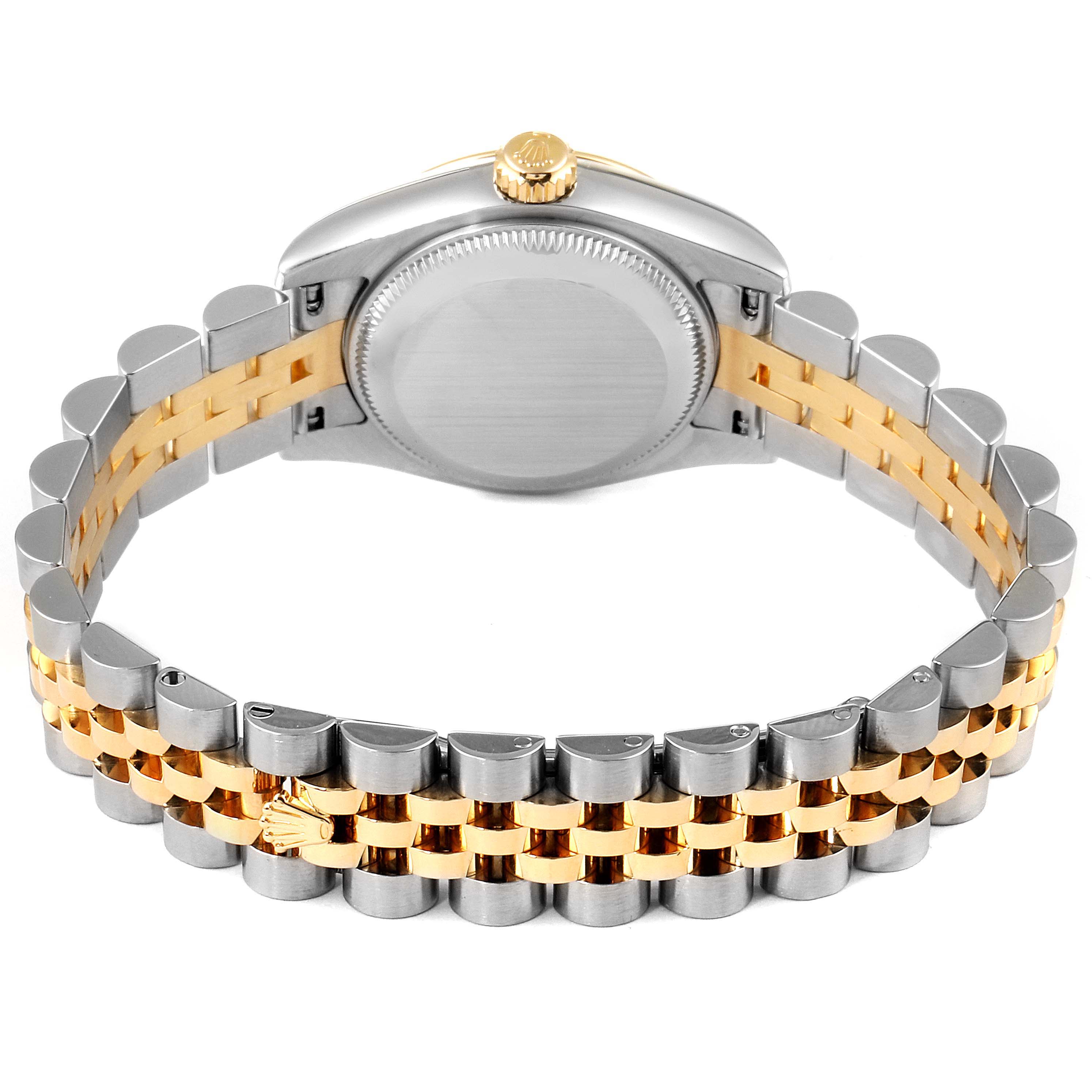 The image shows the back of the Rolex Datejust 179173 Women
s Steel and Gold (two tone) Champagne Dial 179173 Women
s Steel and Gold (two tone) Champagne Dial watch, including its two-tone Jubilee bracelet and case back.