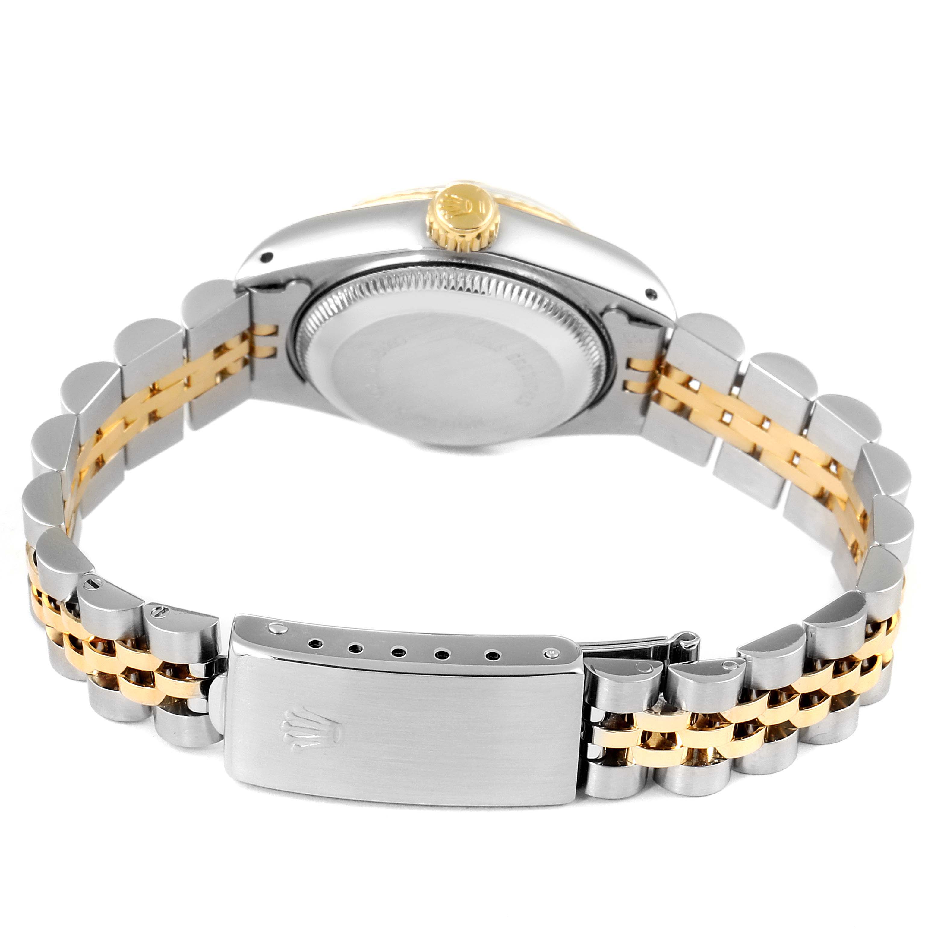 This Rolex Datejust 69173 Women
s Steel and Gold (two tone) Champagne Dial 69173 Women
s Steel and Gold (two tone) Champagne Dial watch is shown from the back, illustrating the clasp, bracelet, and case back.
