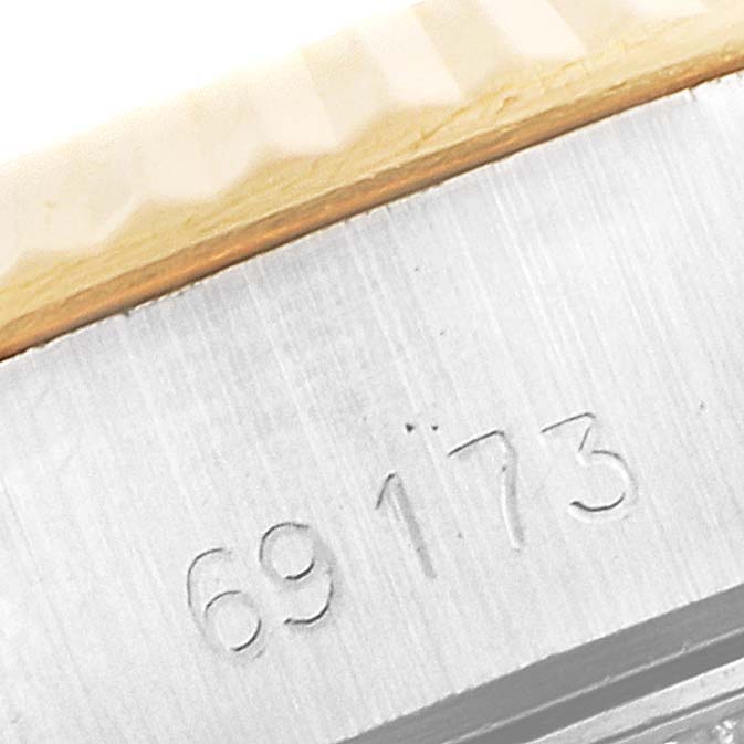 This image shows a close-up of the case with the model number of the Rolex Datejust 69173 Women
s Steel and Gold (two tone) Champagne Dial 69173 Women
s Steel and Gold (two tone) Champagne Dial watch.