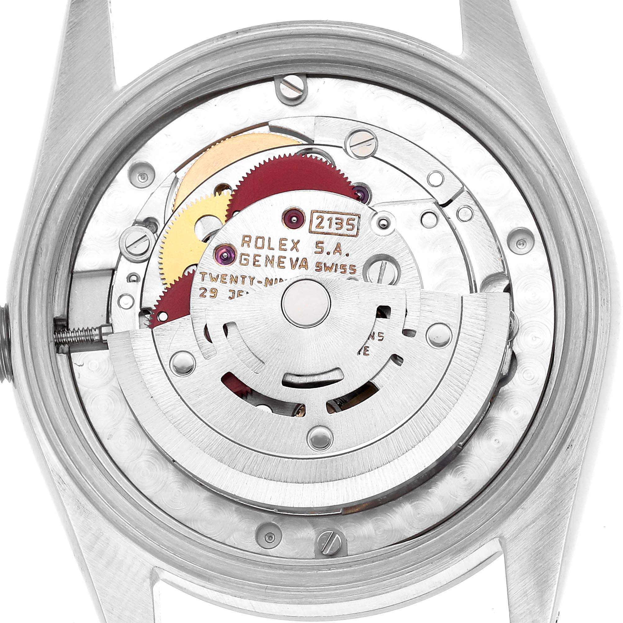 The image shows the movement of a Rolex Datejust 68240 Women's Stainless Steel Pink Dial from the rear, highlighting the rotor and intricate mechanisms.