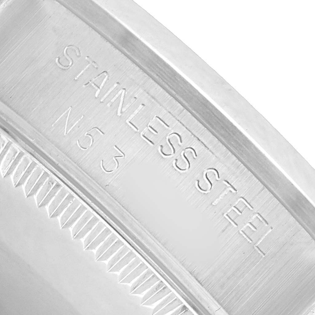 This image shows a close-up of the inner bezel of a Rolex Datejust 68240 Women's Stainless Steel Pink Dial, highlighting the "STAINLESS STEEL" inscription.