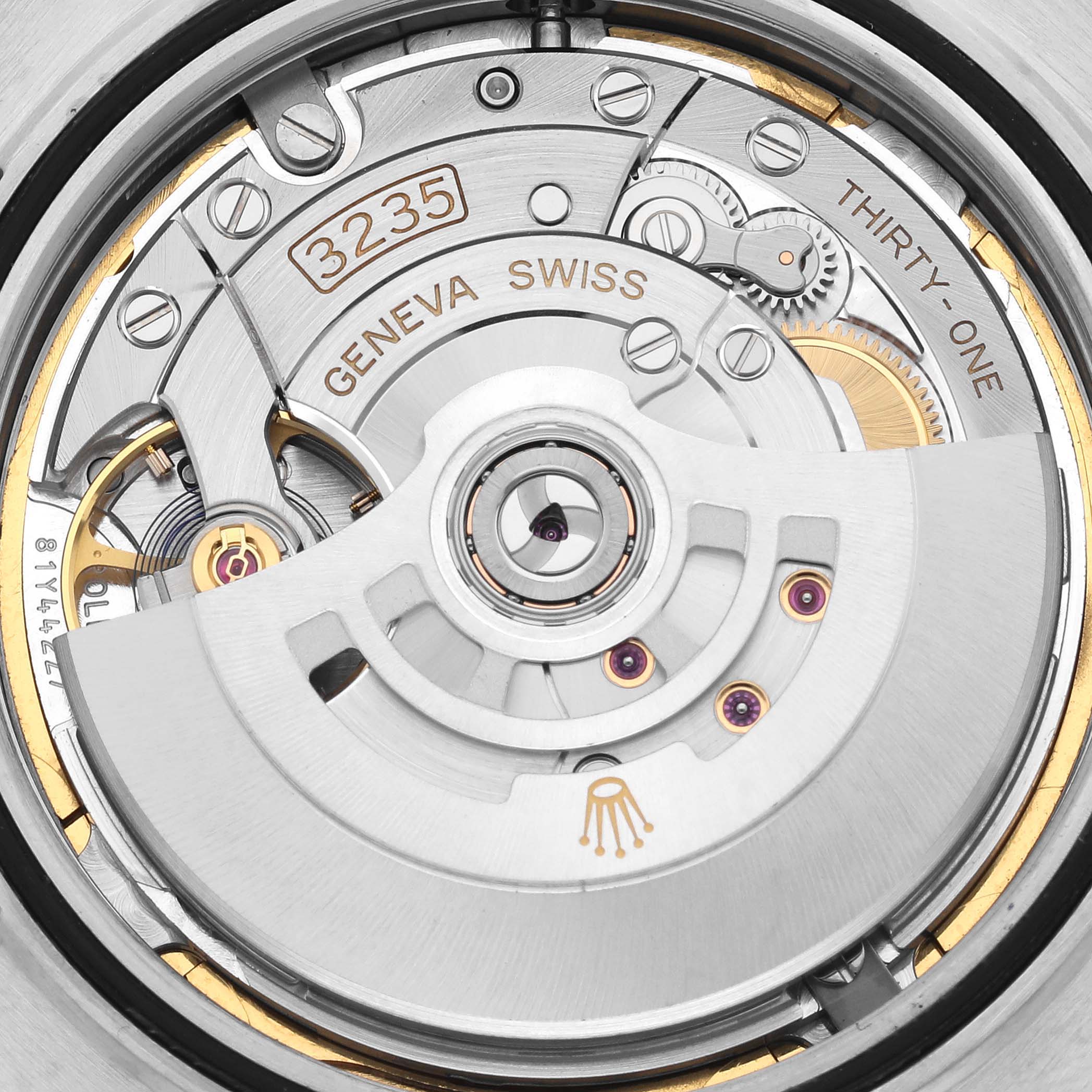 The image shows the movement mechanism of the Rolex Datejust 41 126331 Men
s Steel and Gold (two tone) Brown Dial 126331 Men
s Steel and Gold (two tone) Brown Dial from a rear angle, highlighting its intricate components.