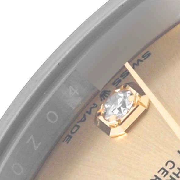 The image shows a close-up of the dial on the Rolex Datejust, highlighting the diamond marker and partial text.