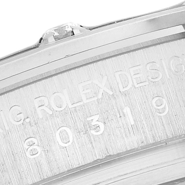 The image shows a close-up of the engraved side of a Rolex Pearlmaster 80319 Women
s White Gold Silver Dial 80319 Women
s White Gold Silver Dial watch, highlighting its model number and branding.