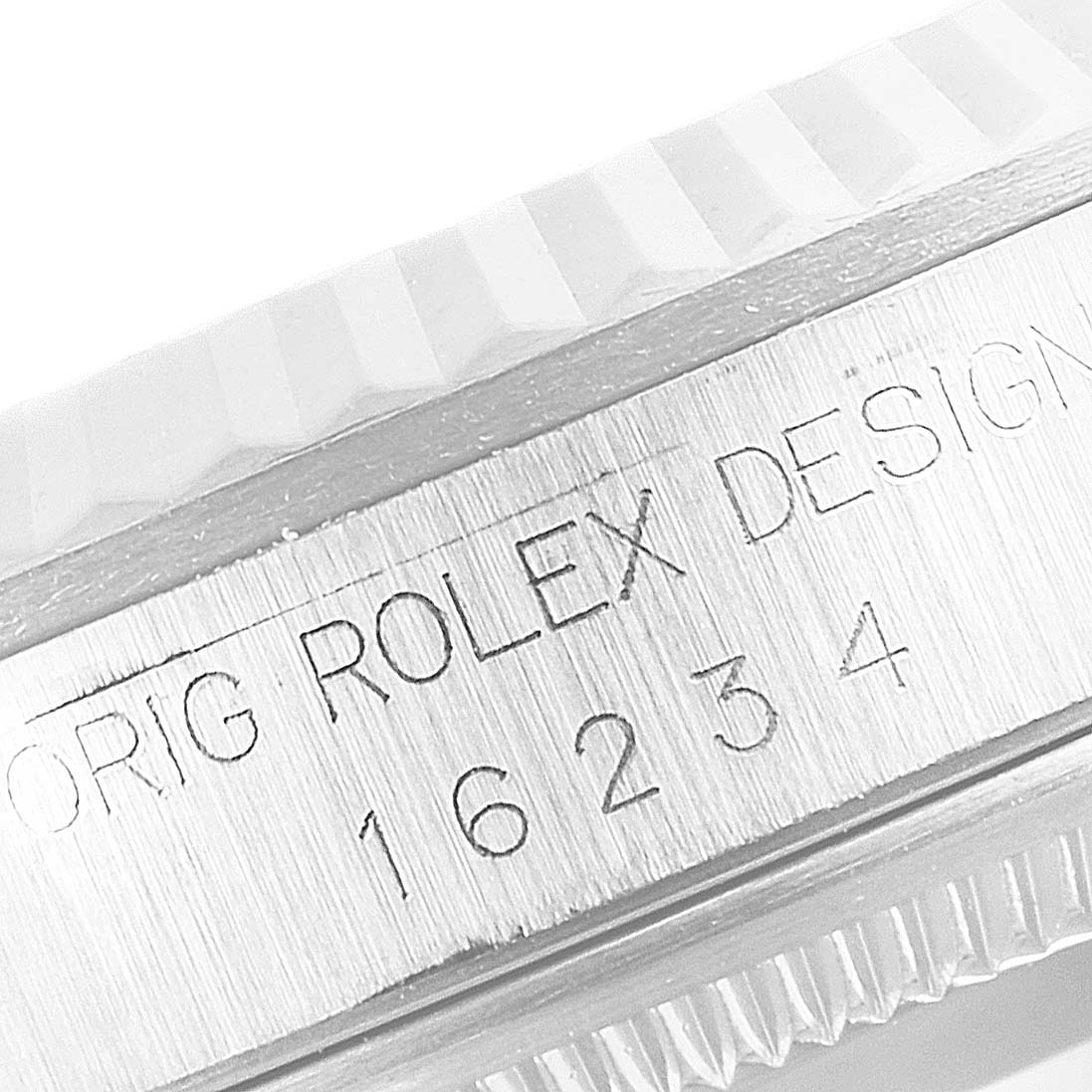 This image shows a close-up of the side of a Rolex Datejust 16234 Men's Stainless Steel Silver Dial 16234 Men's Stainless Steel Silver Dial watch with its model number "16234" engraved.
