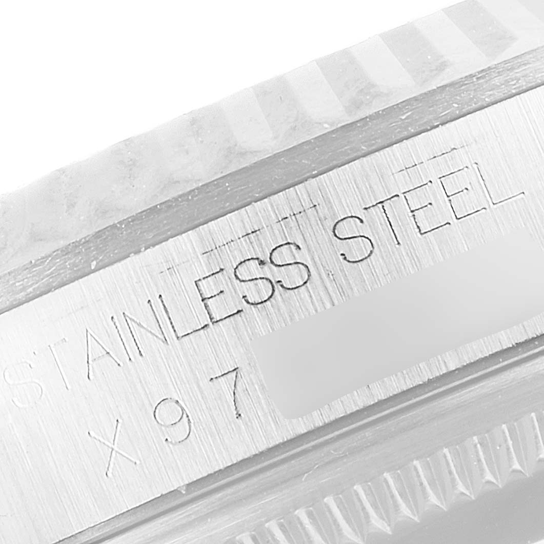 This is a close-up of the stainless steel casing back of a Rolex Datejust 16234 Men's Stainless Steel Silver Dial 16234 Men's Stainless Steel Silver Dial watch.