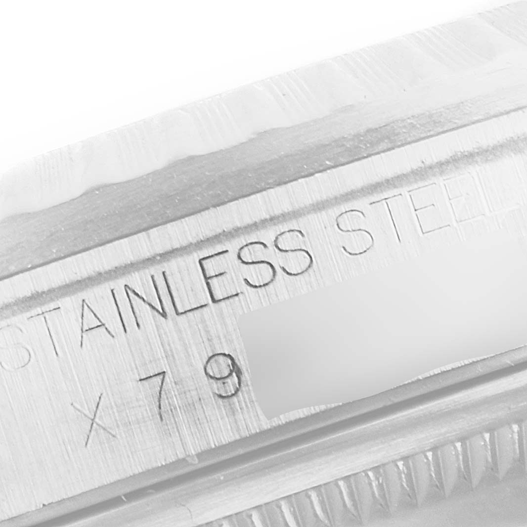 Close-up angle of the side of the case, showing the engraved "STAINLESS STEEL" text on the Rolex Datejust 16220 Men's Stainless Steel Silver Dial 16220 Men's Stainless Steel Silver Dial watch.