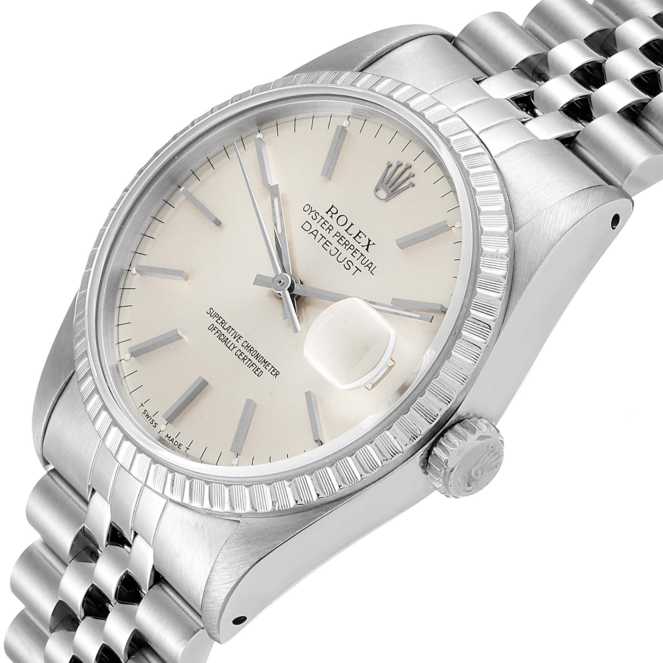 This image shows a close-up of the Rolex Datejust 16220 Men's Stainless Steel Silver Dial 16220 Men's Stainless Steel Silver Dial watch face and crown, angled slightly above eye level.