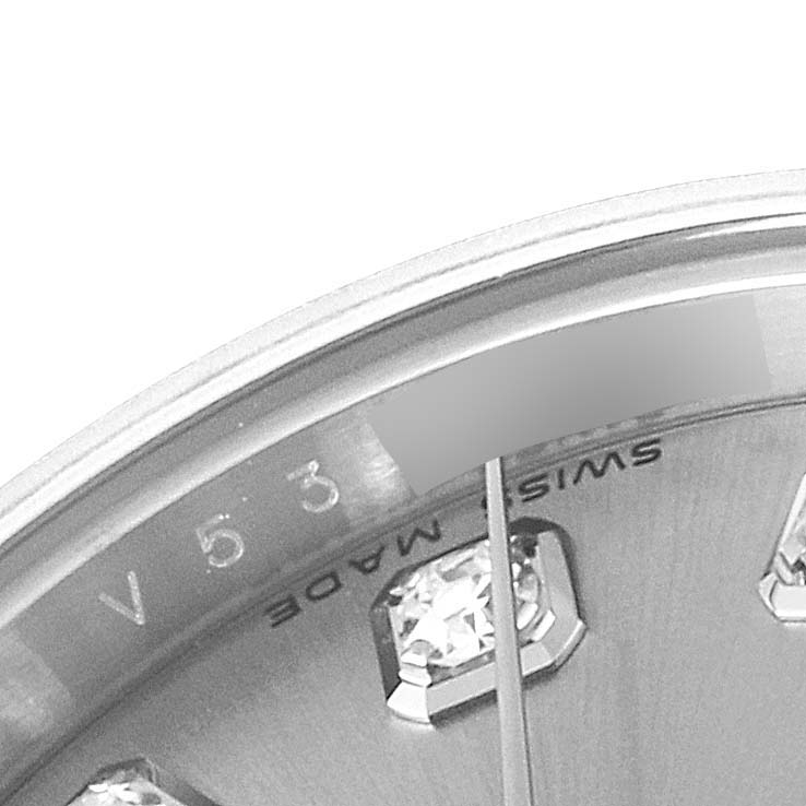 This close-up of a Rolex Datejust 179174 Women
s Stainless Steel Silver Dial 179174 Women
s Stainless Steel Silver Dial watch shows part of the dial, indices with diamonds, and the "Swiss Made" text near the bottom.