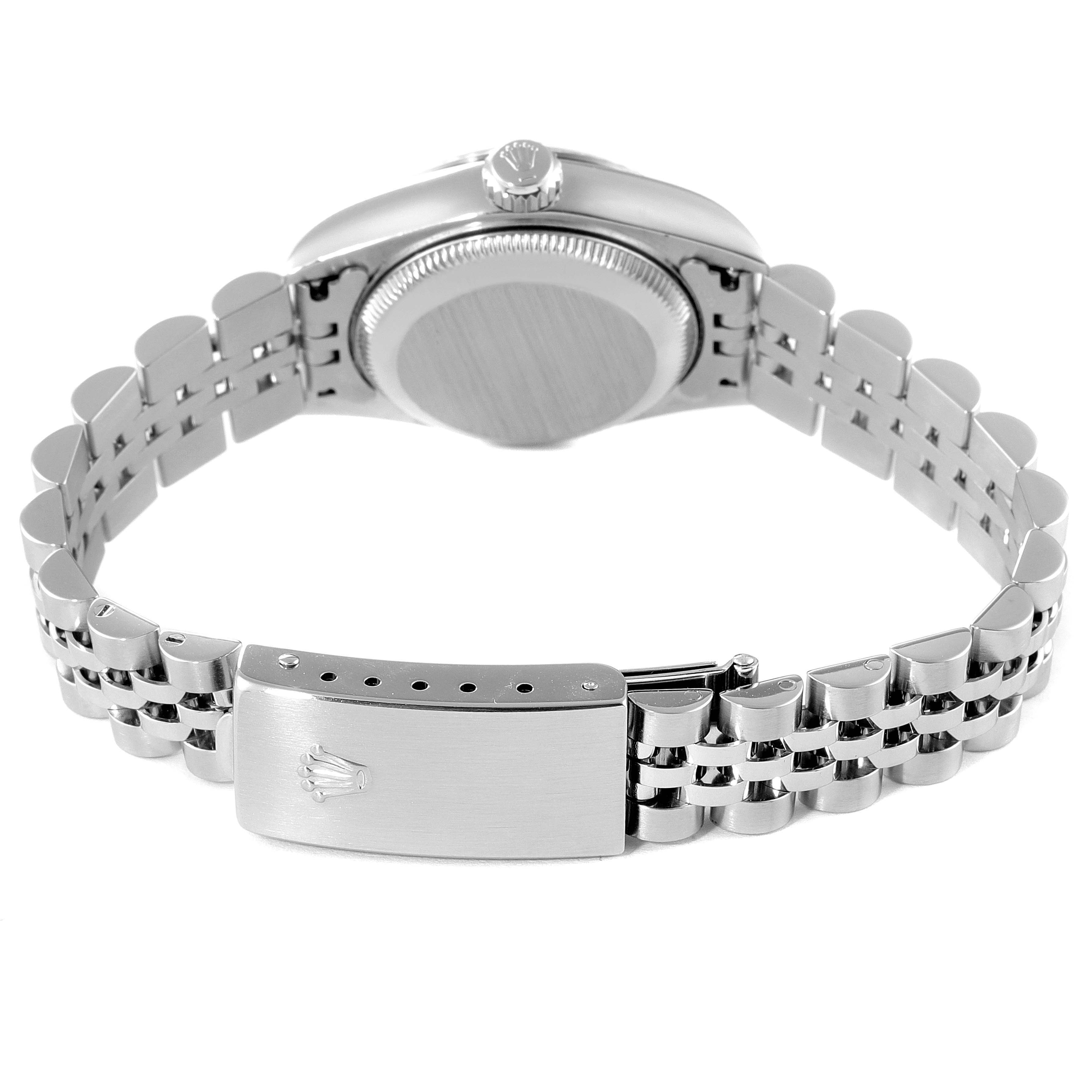 This image showcases the back view of a Rolex Datejust 79174 Women
s Stainless Steel Mother of Pearl Dial 79174 Women
s Stainless Steel Mother of Pearl Dial watch, focusing on its case back, crown, and bracelet clasp.