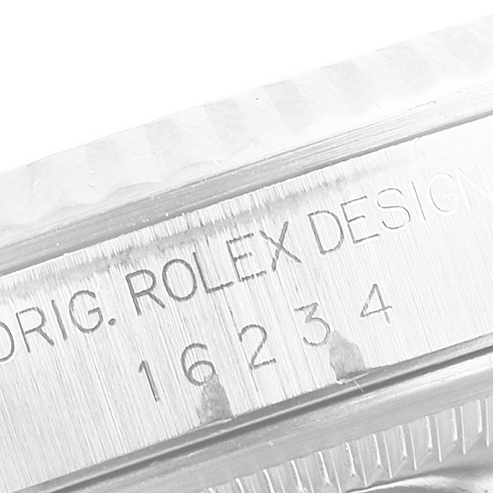 The image shows a close-up of the case's inner rim and reference number on a Rolex Datejust 16234 Men's Stainless Steel Silver Dial 16234 Men's Stainless Steel Silver Dial model.