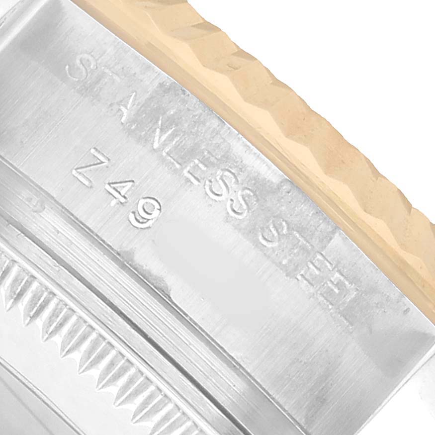 The image shows a close-up of the rehaut and bezel of a Rolex Datejust 179173 Women's Steel and Gold (two tone) Champagne Dial, highlighting the stainless steel material.