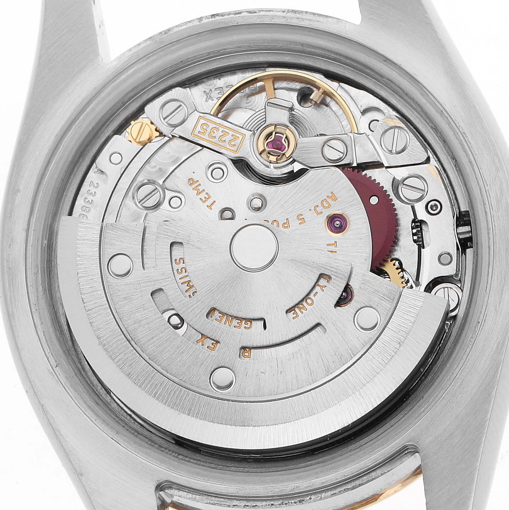 This image shows the inner mechanism of a Rolex Datejust 179173 Women's Steel and Gold (two tone) Champagne Dial watch from a back angle, revealing the rotor and movement components.