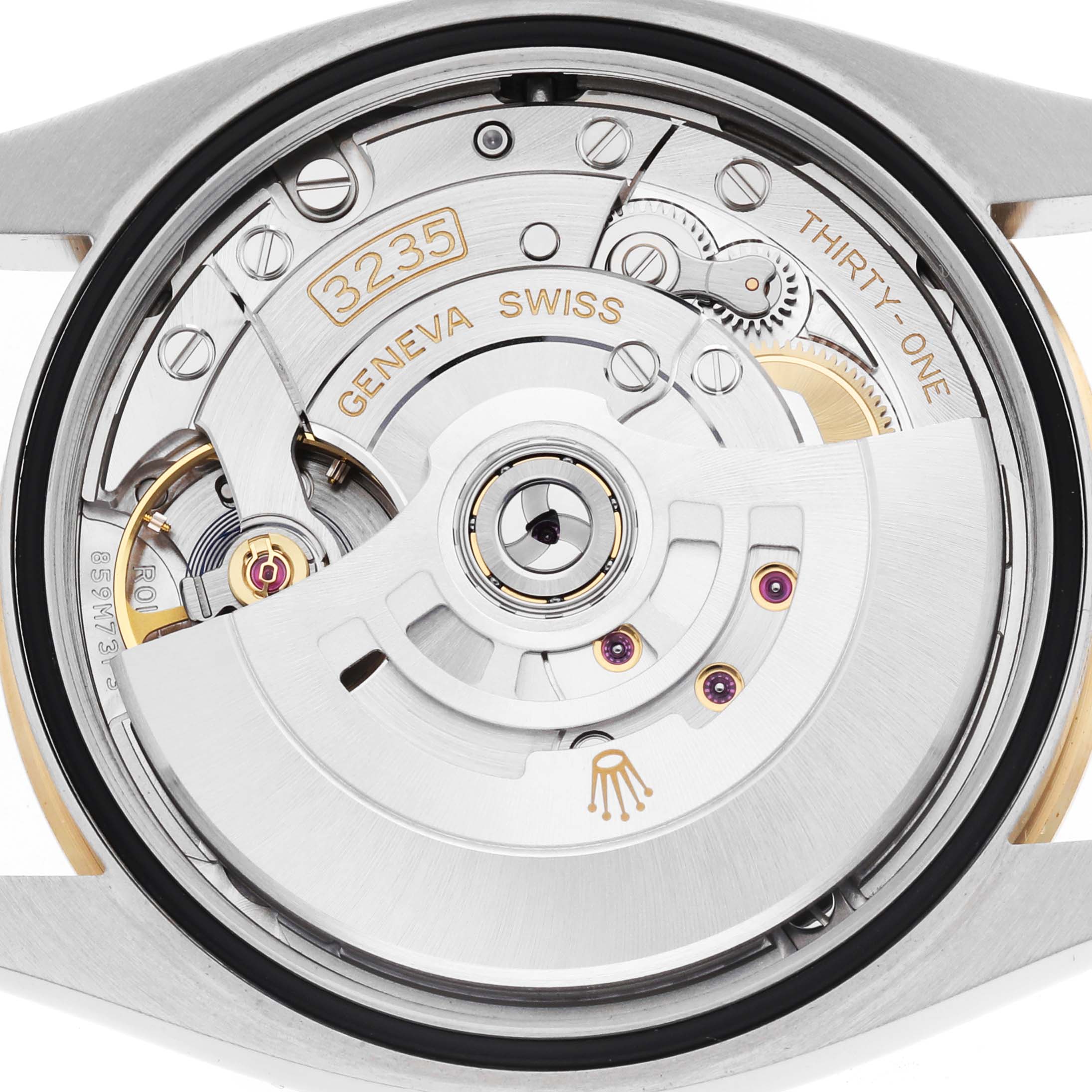The image shows the back view of a Rolex Datejust 126233 Men's Steel and Gold (two tone) Champagne Dial, highlighting its internal movement and mechanics.